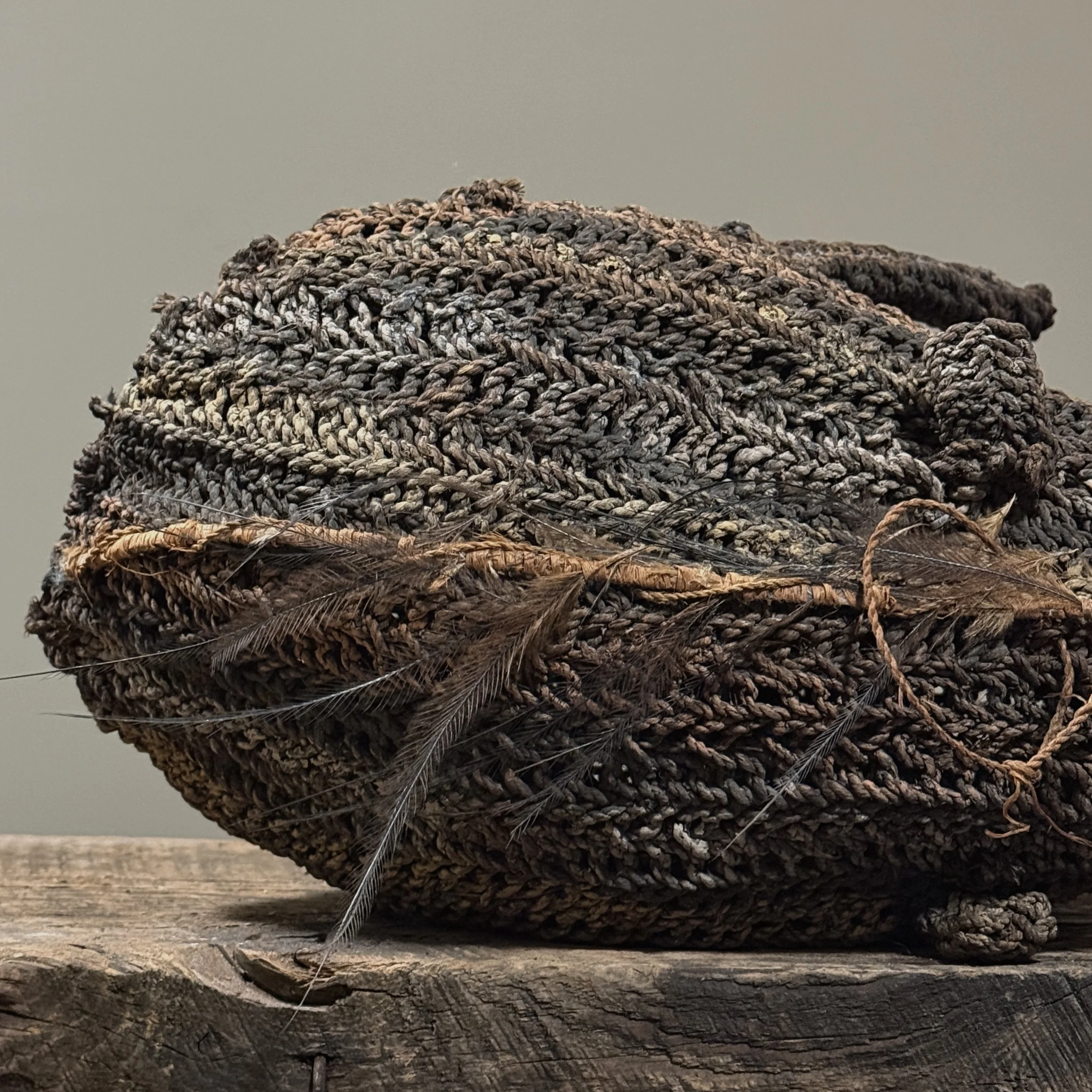 Detail of painted fiber and raffia. Decorative elements on bird body.
