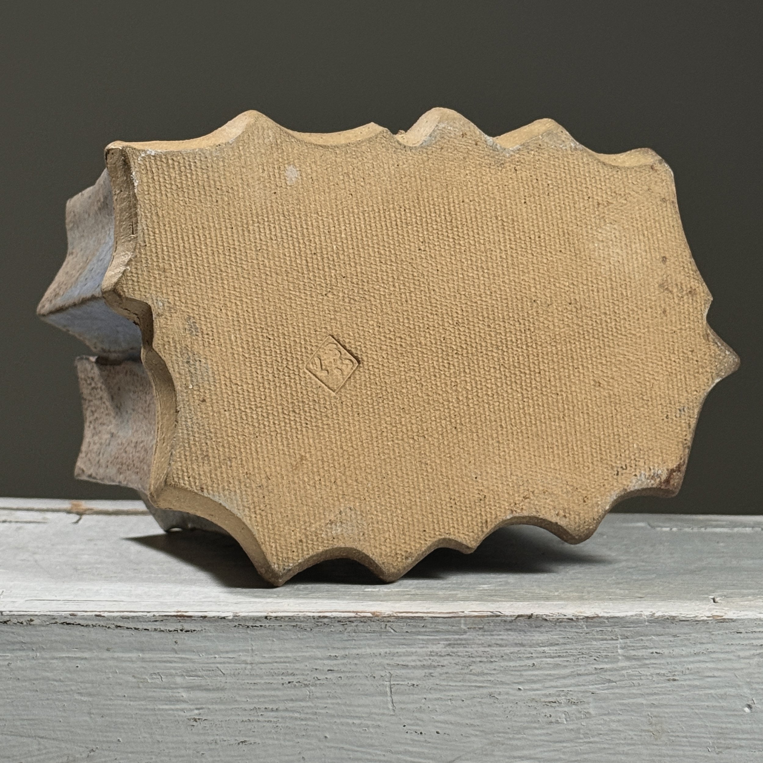 The base with artist's stamp.