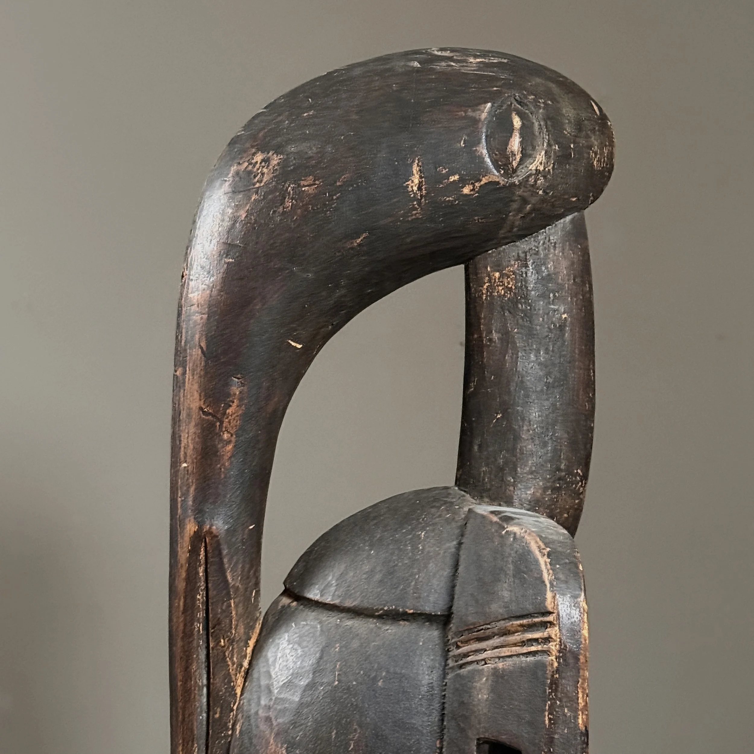 Side view of antique Senufo Calao bird sculpture