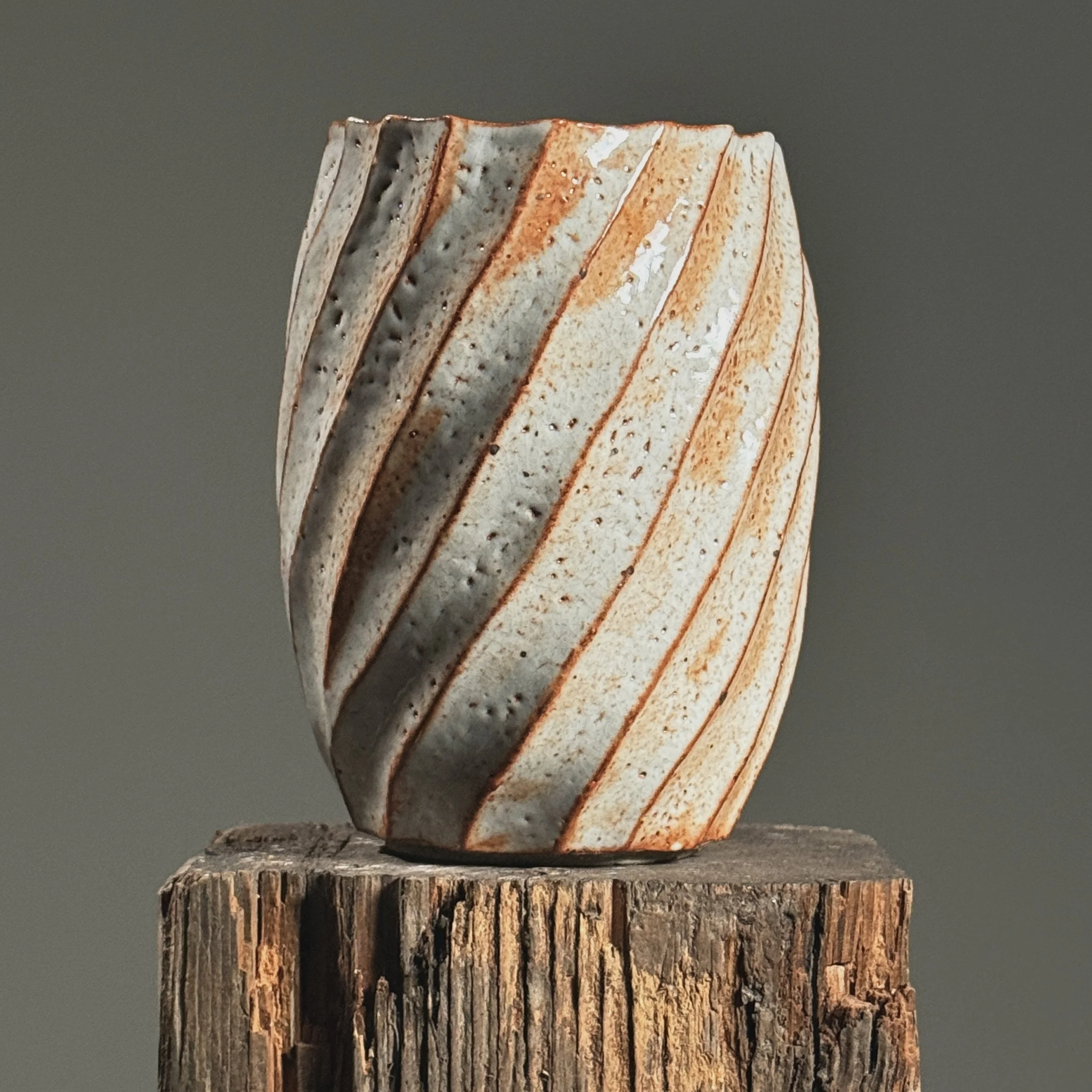 Side profile emphasizing the sculptural swirling shape.