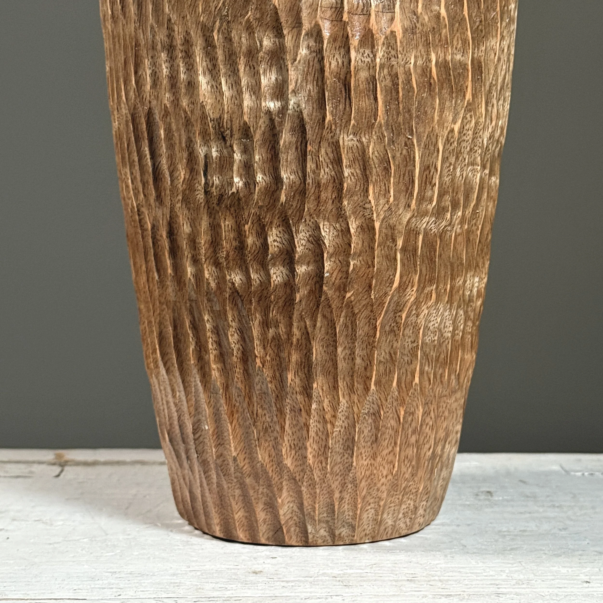 Detail of the chip-carved geometric pattern on the surface.