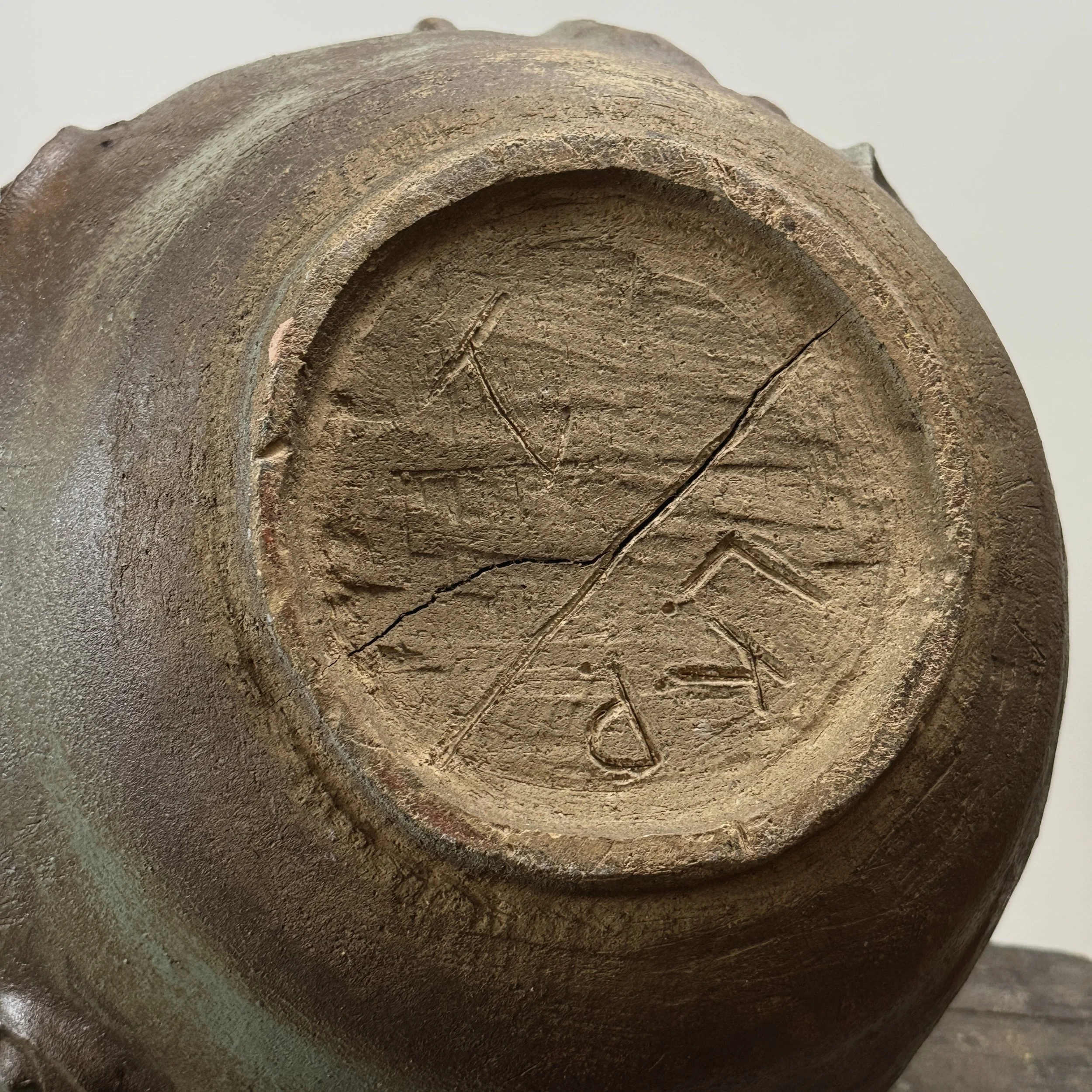 Signature on the bottom of the vessel.
