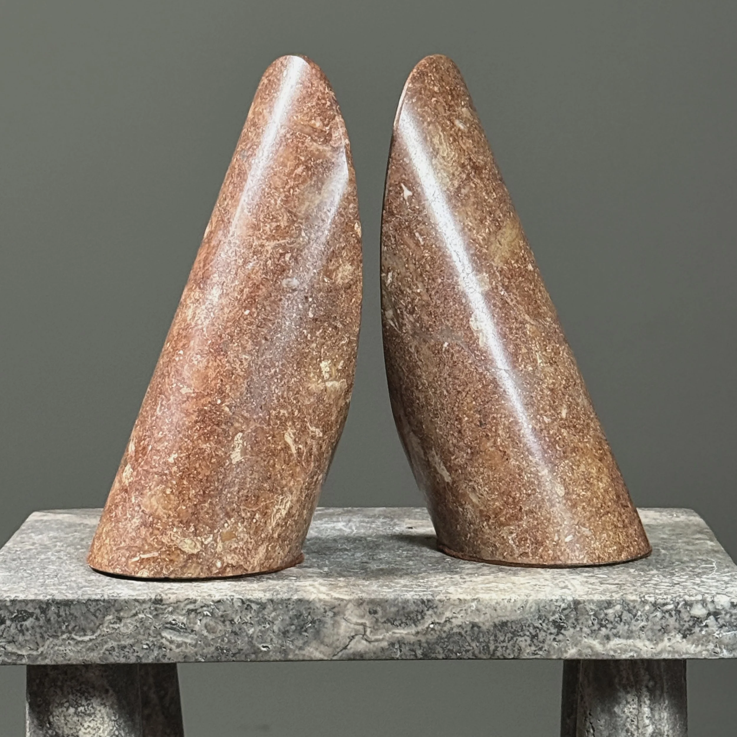 Pair of vintage Italian Modernist cylindrical stone bookends. Rosy brown. Each 7.75 inches high.