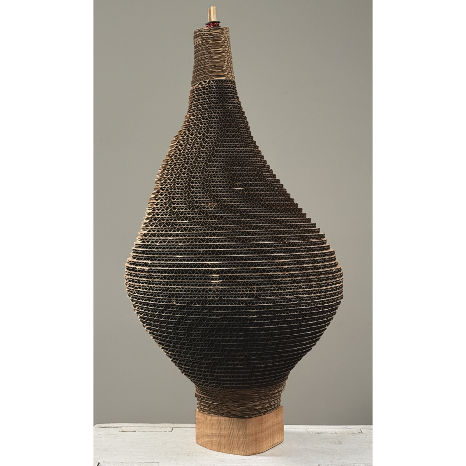 Vintage biomorphic postmodernist corrugated cardboard sculpture on carved wood base