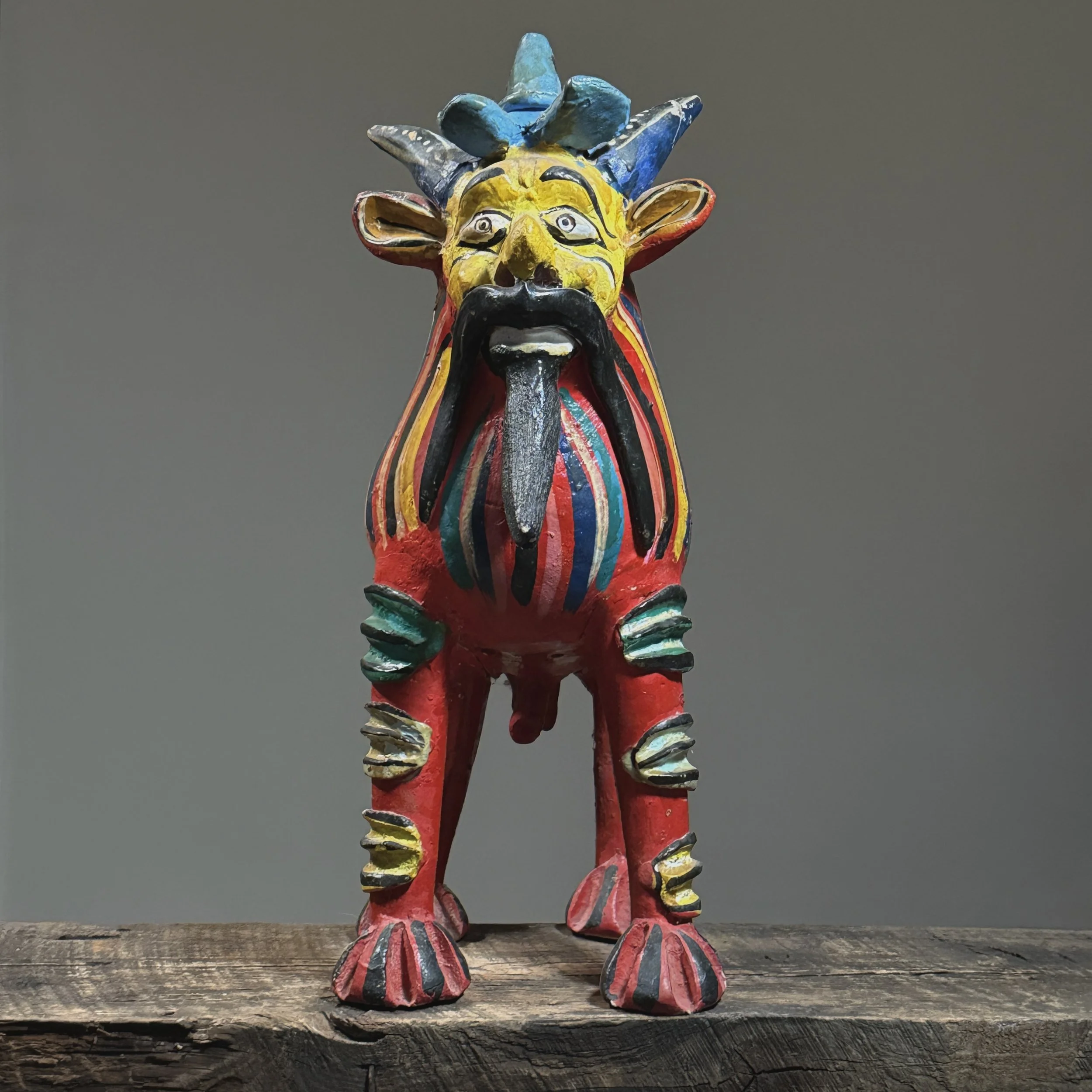 Full frontal view of a vintage Candelario Medrano Mexican folk art polychrome monster sculpture