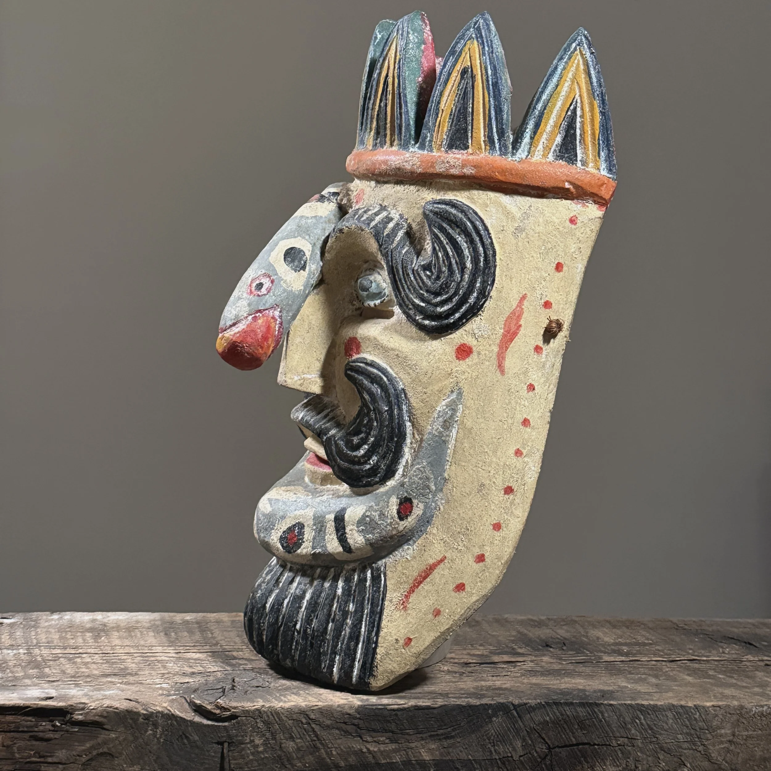Profile view of the mask showing depth and carving style.