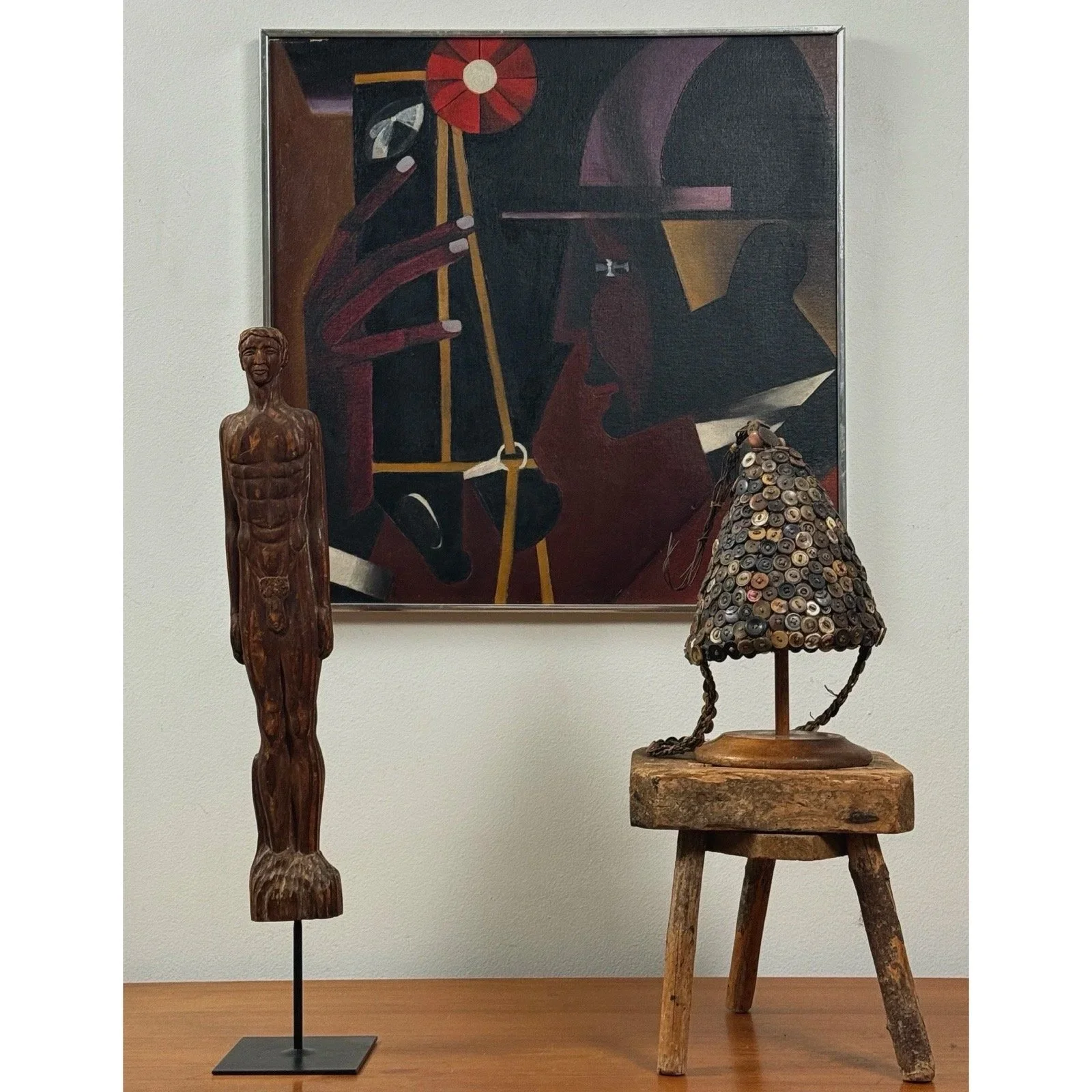 Front view of a modernist horse and jockey painting in a silver frame in a vignette.