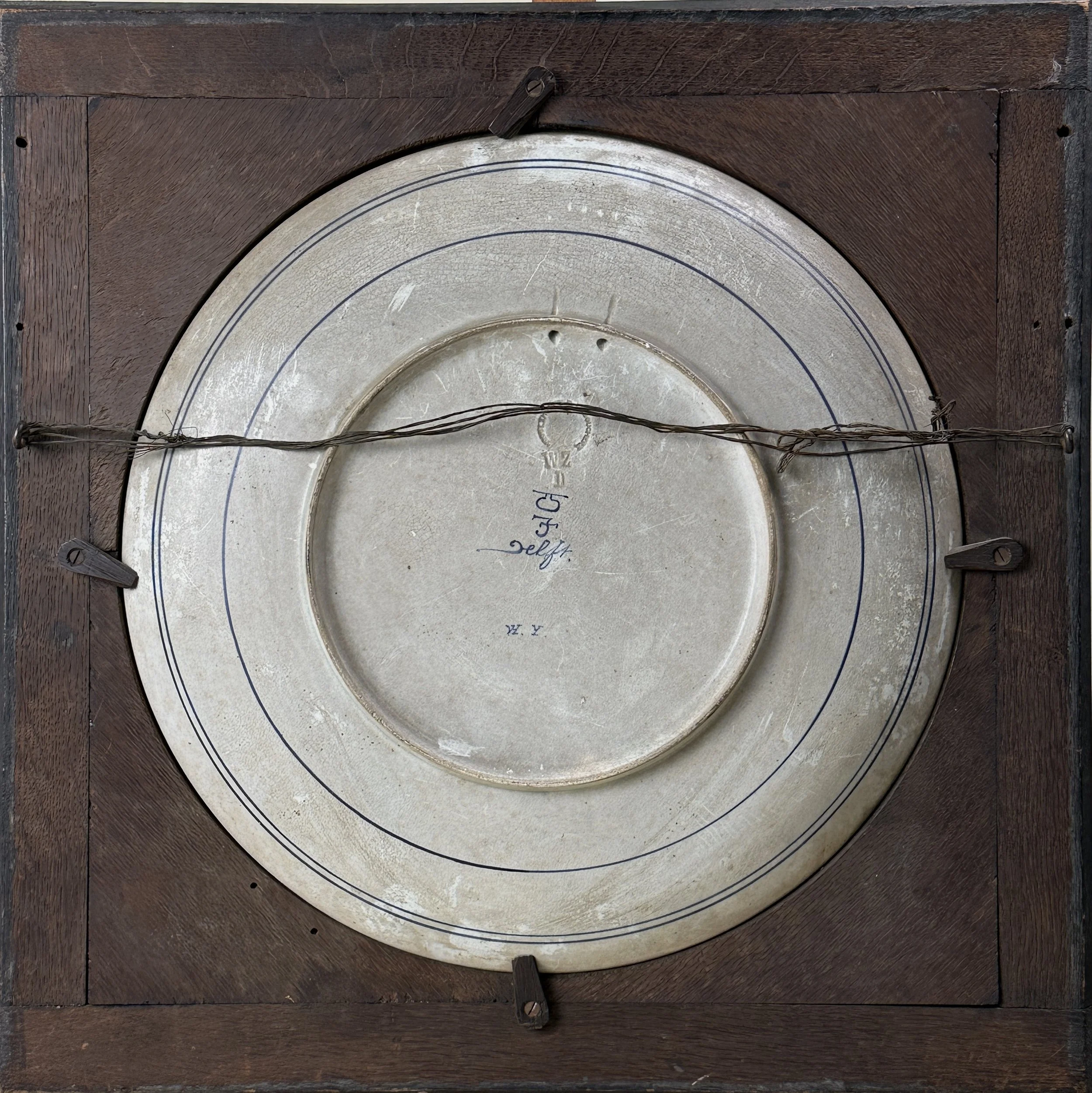 Verso of charger. Joost Thooft & Labouchere stamp visible. Signed and dated.