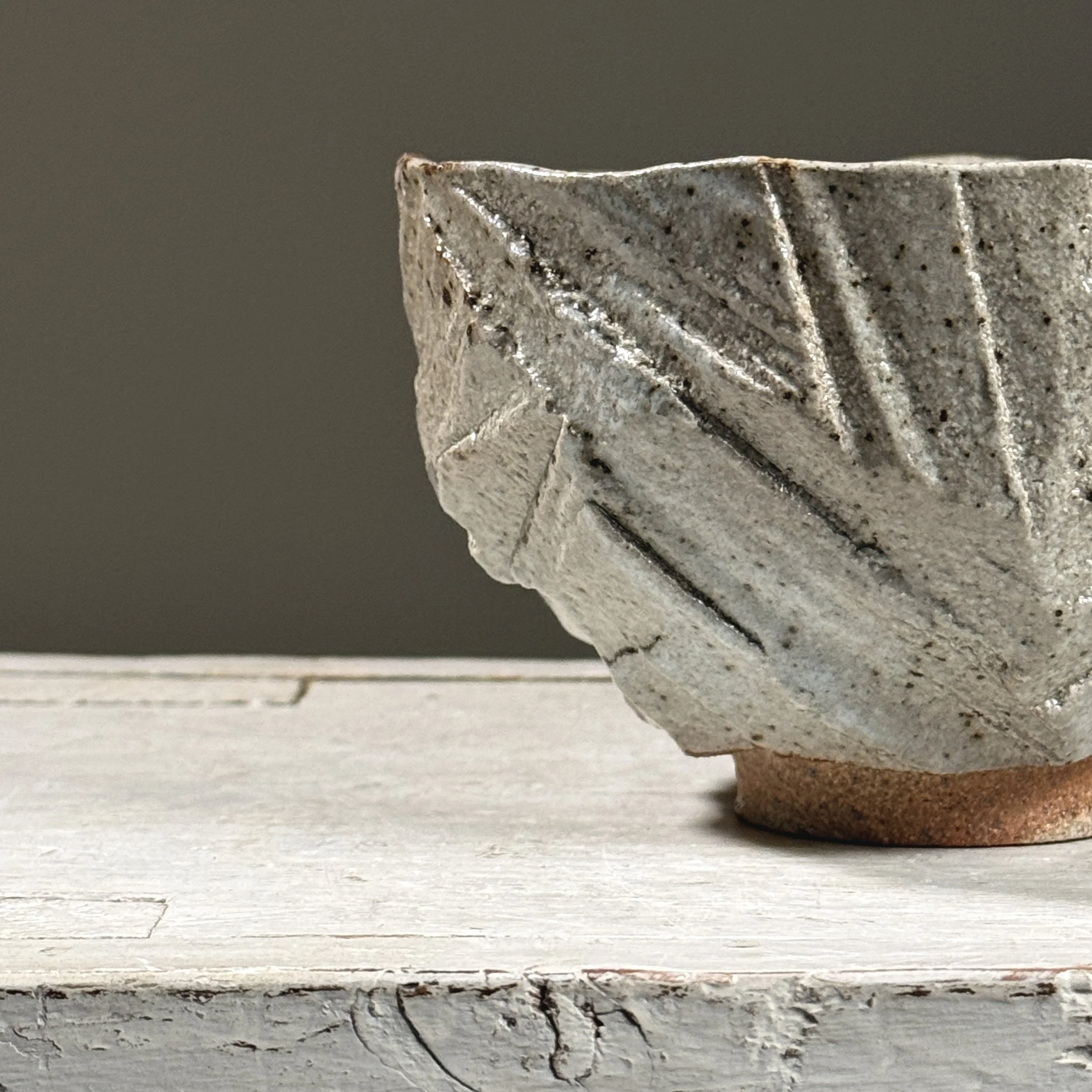 Detail of geometric carved and hacked patterns on the exterior