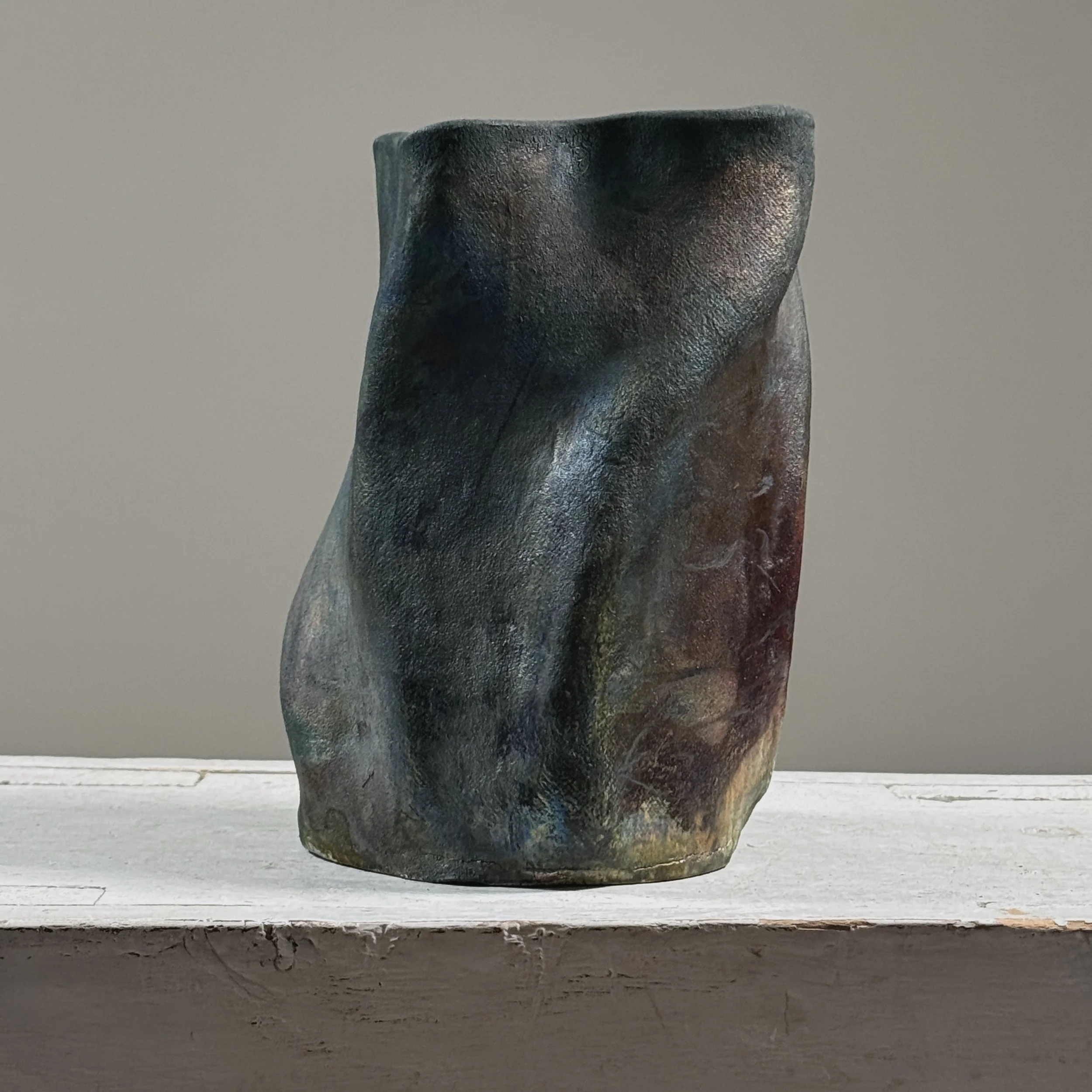 Vintage raku fired abstract fluid shaped blackware ceramic vessel, signed