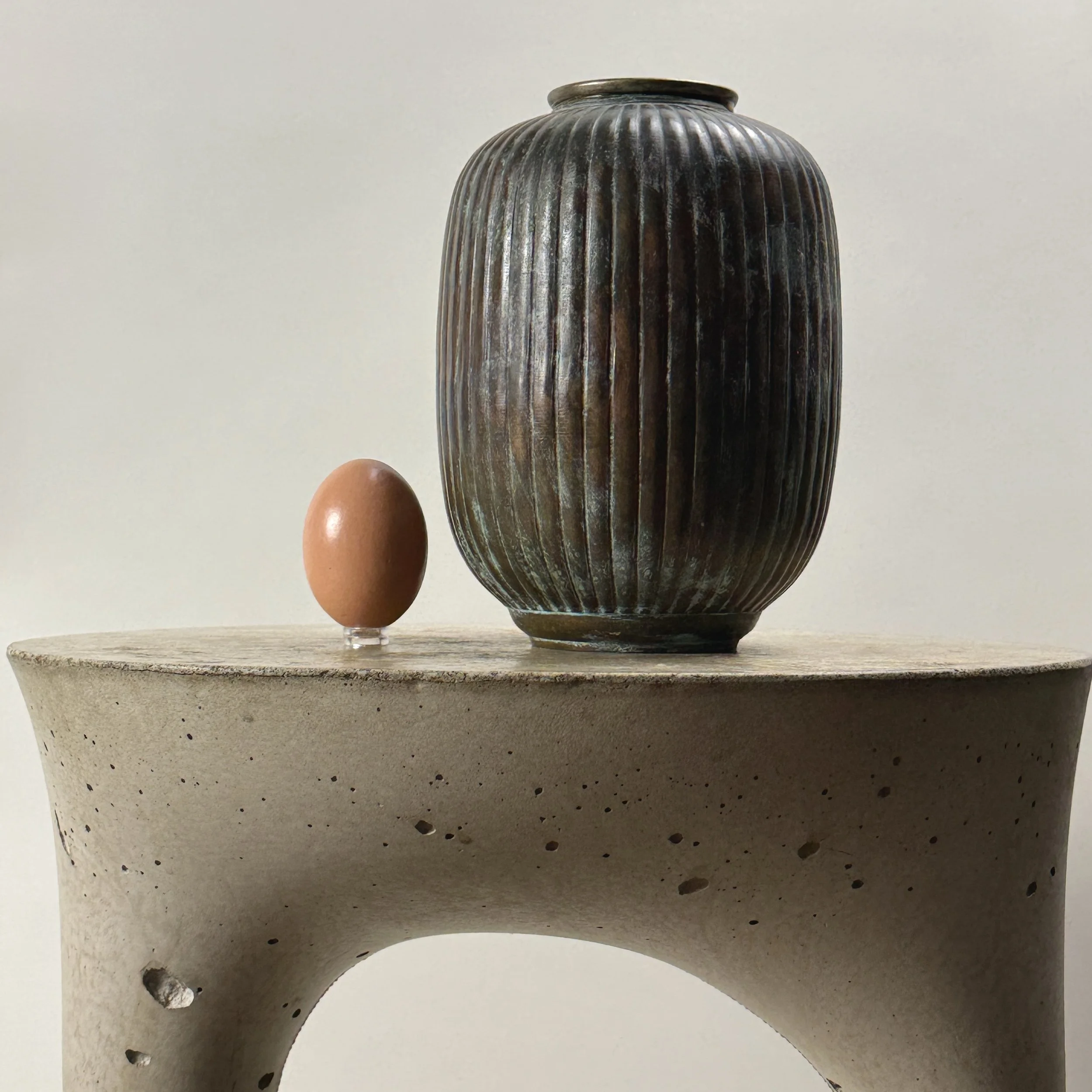 Vase with an egg for size reference.
