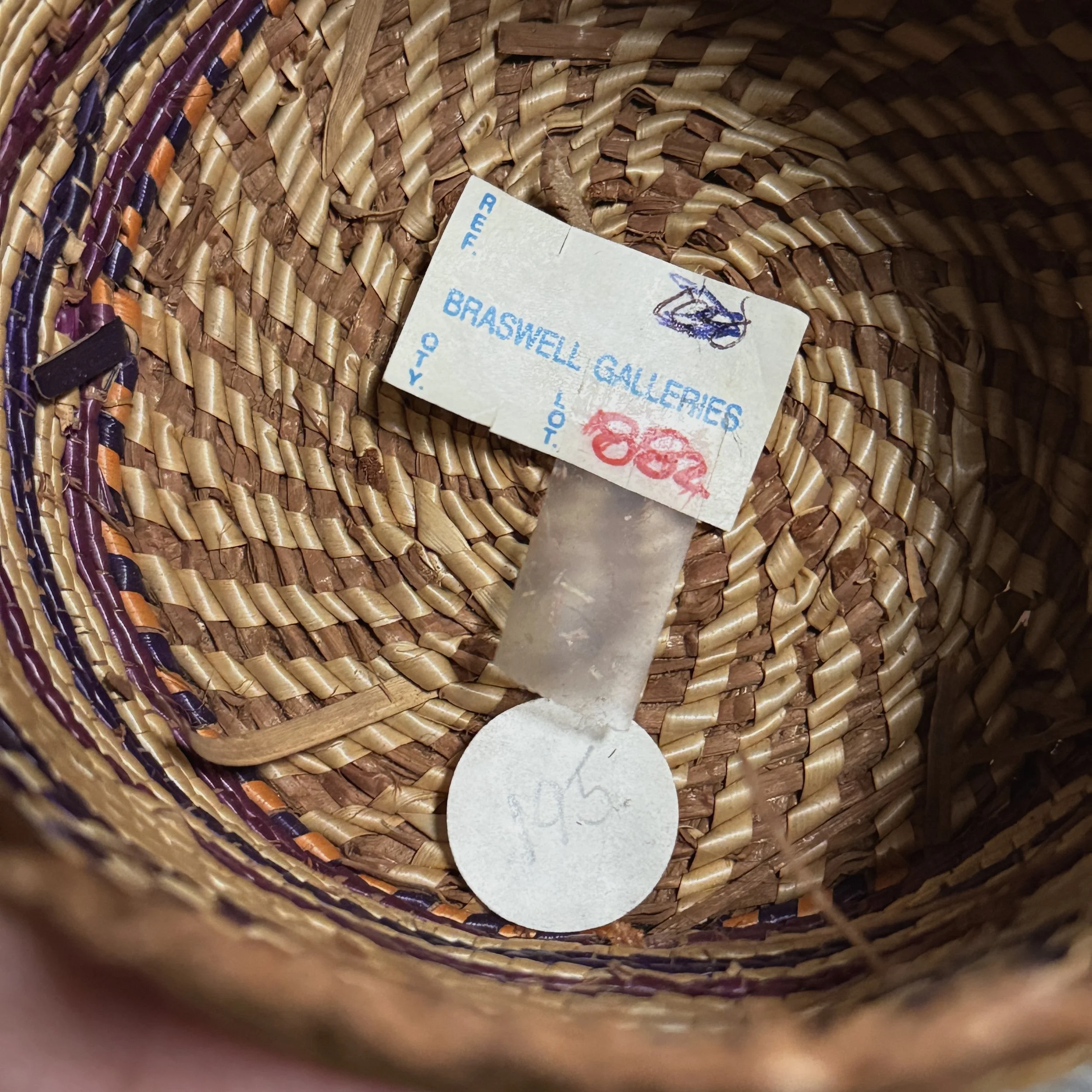 Detail of the original Braswell Galleries tag and lot number attached to the basket