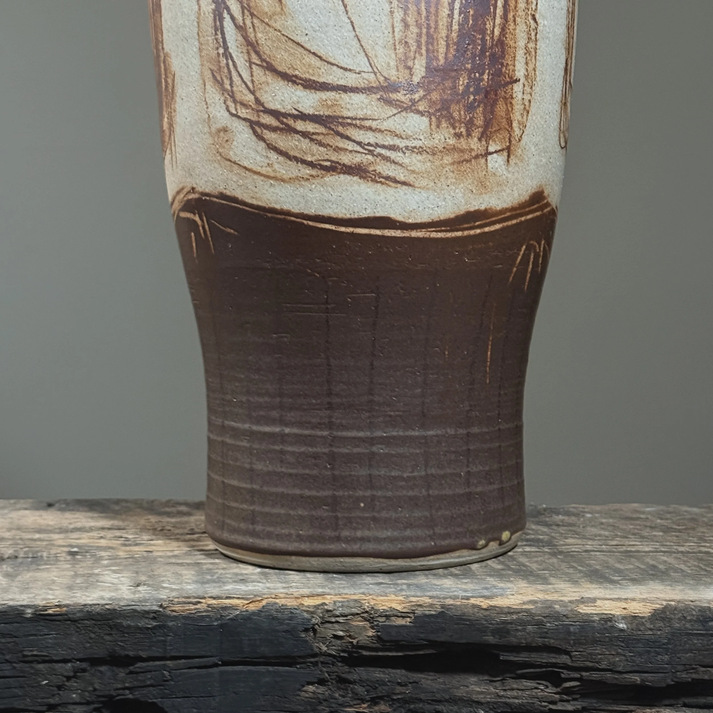 Brown-glazed narrow base on tall art pottery vessel