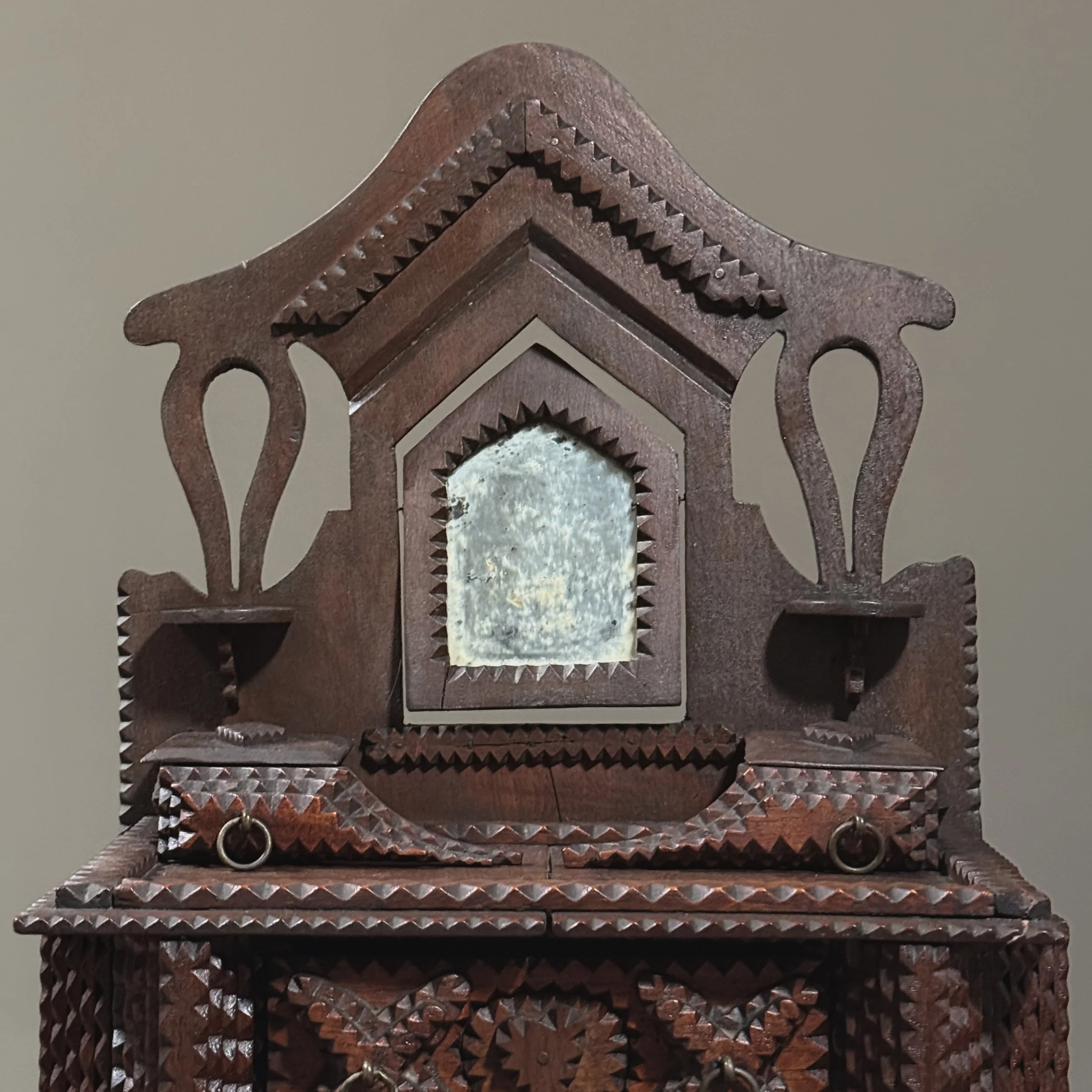 Top view showing mirror flanked by two small drawers and shelves