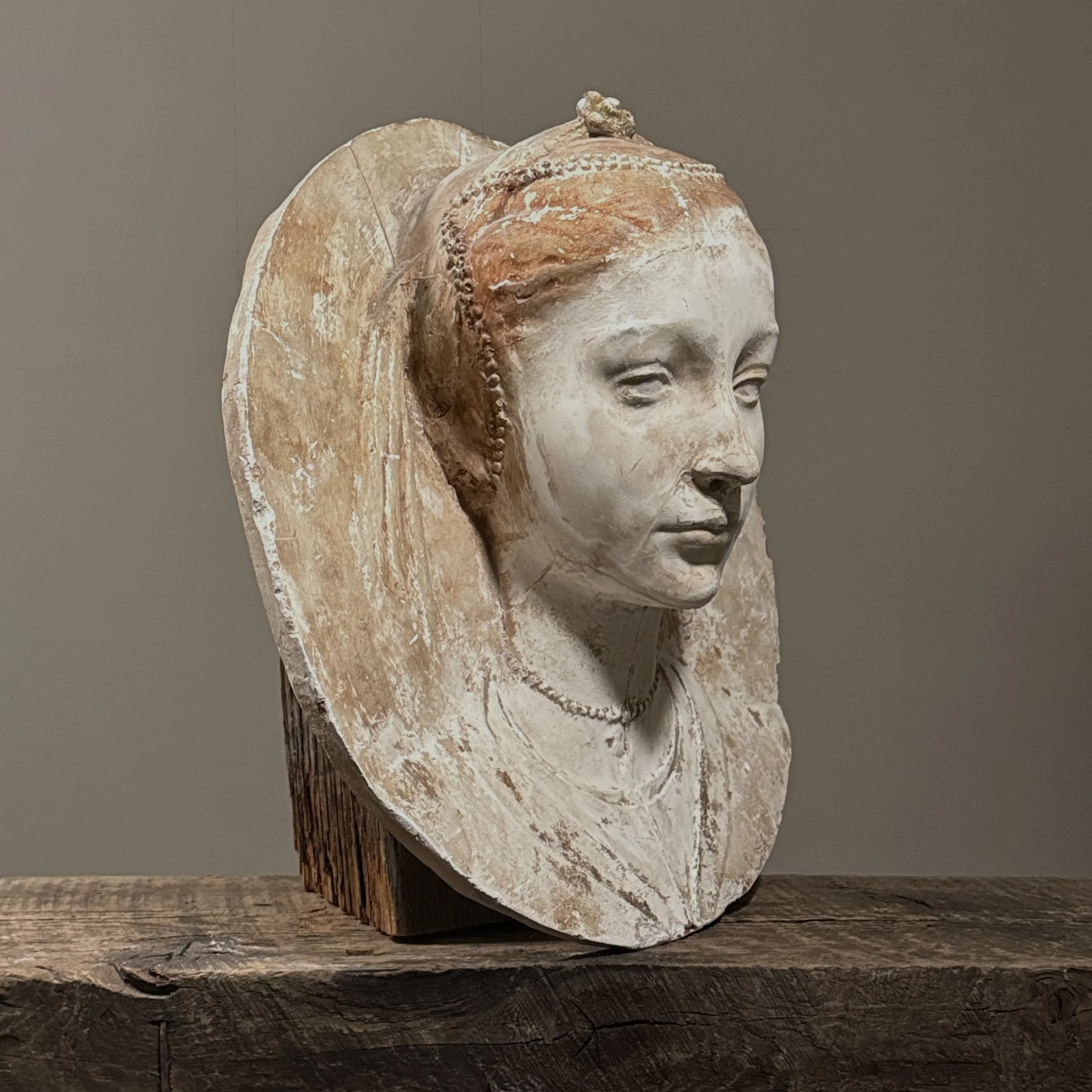 Three-quarter view showing the relief depth and circular form.