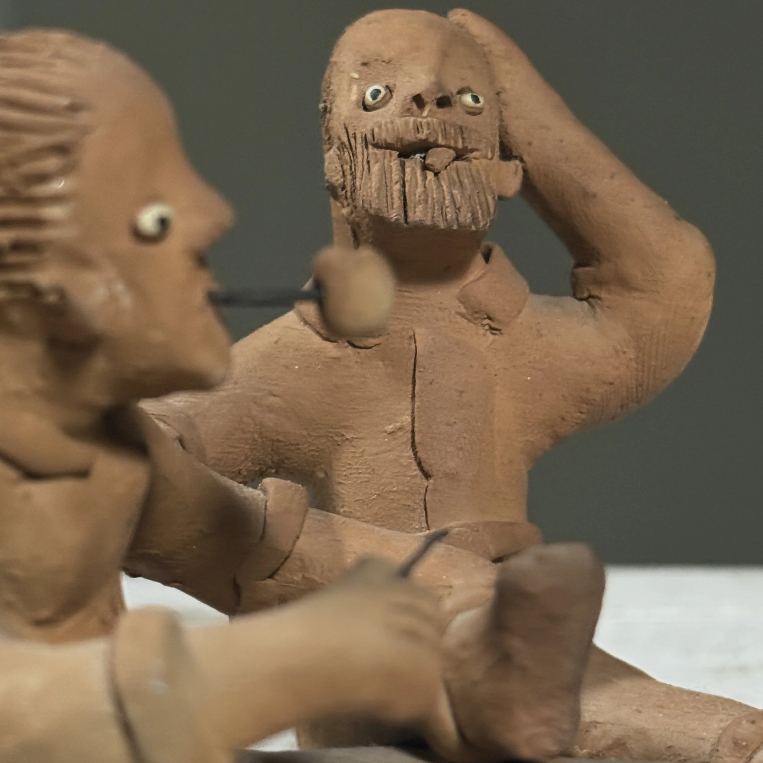 Vintage Brazilian folk art clay sculpture of two figures, signed Berenice
