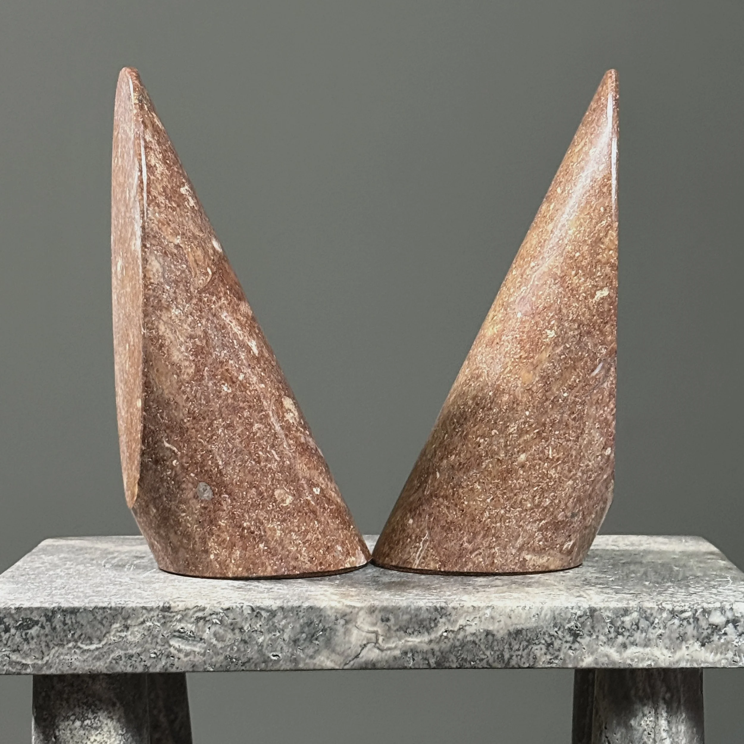 Pair of vintage Italian Modernist cylindrical stone bookends. Rosy brown. Each 7.75 inches high.