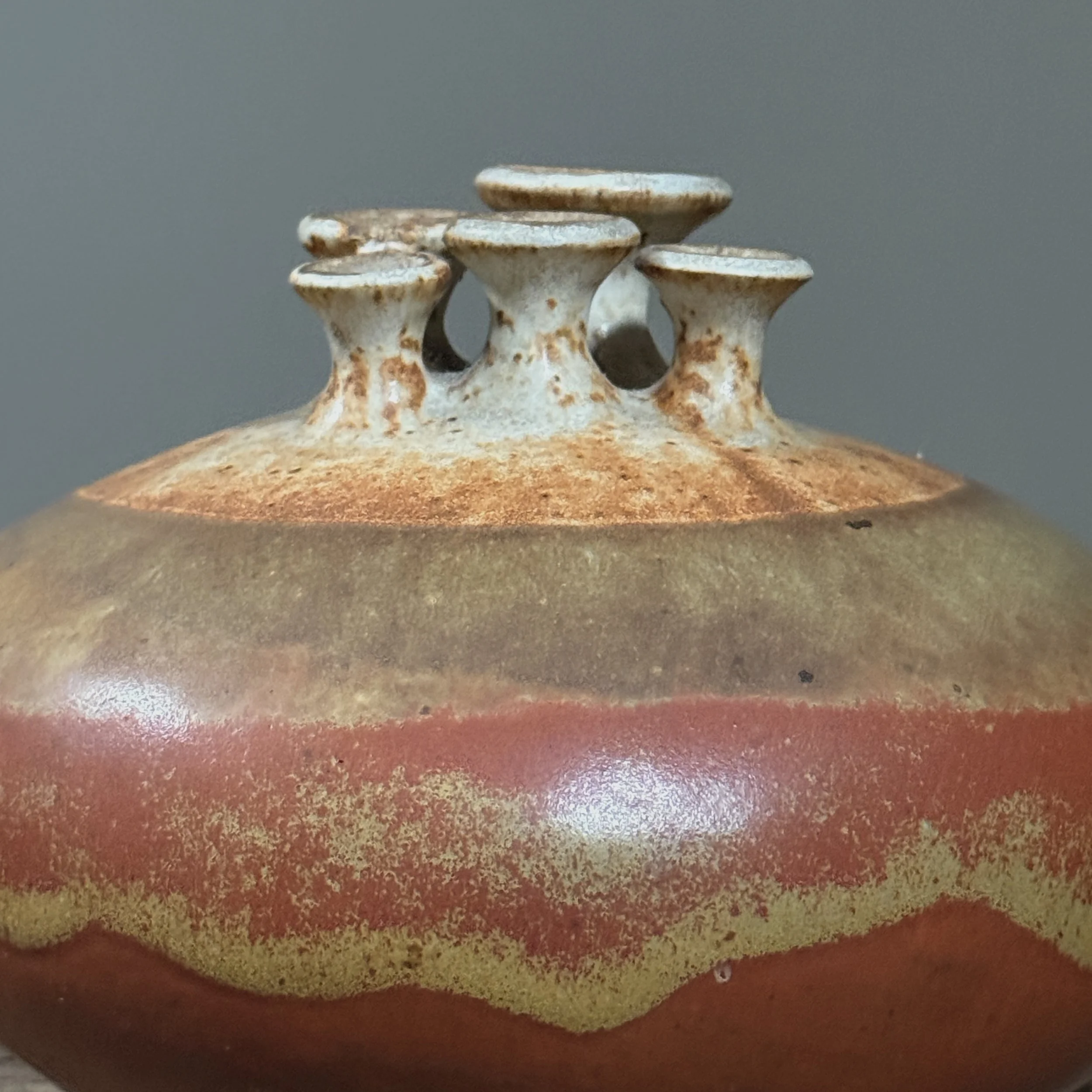 Close-up of Shino glaze flashes on ceramic surface