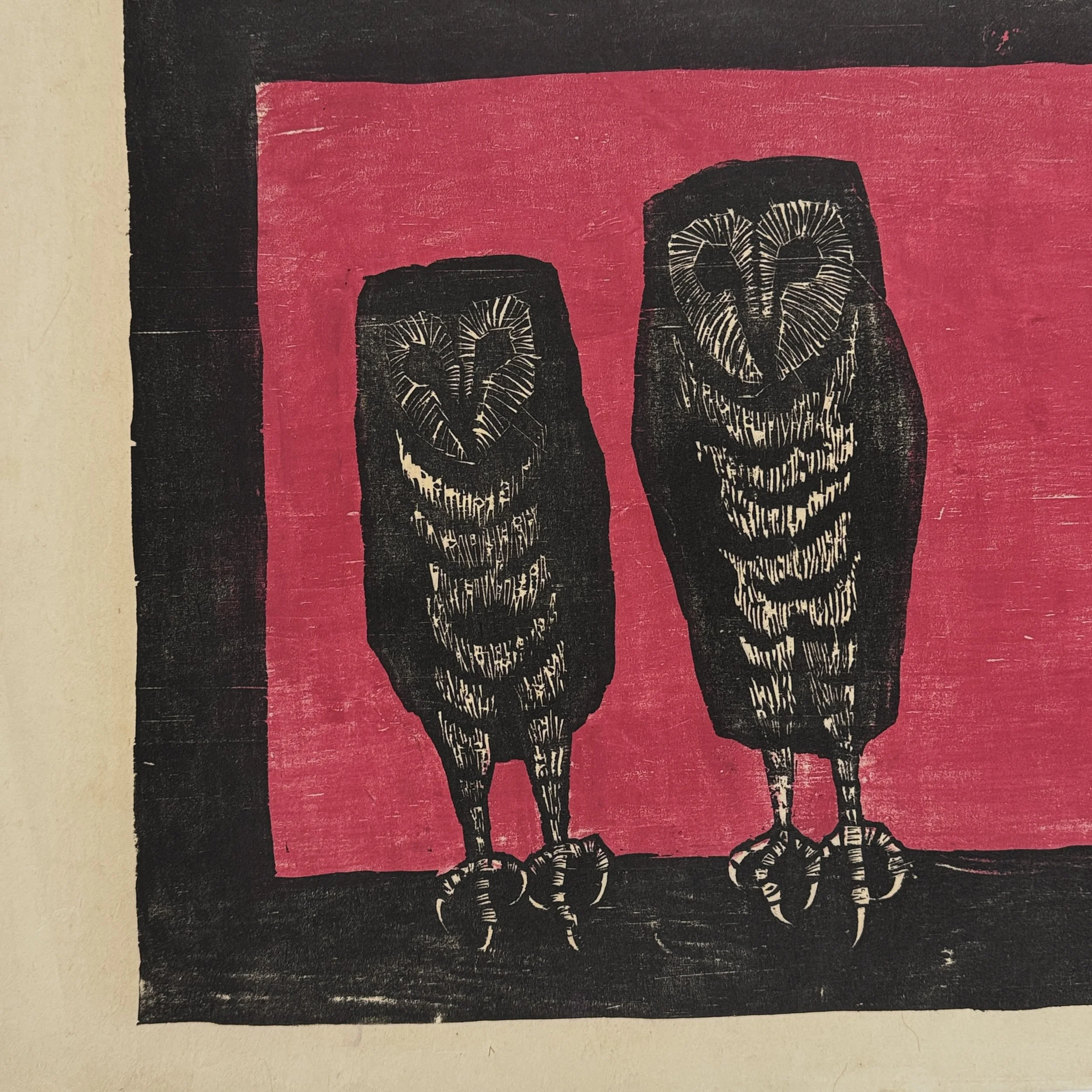 Bold black owls on a deep red background in a Richard Hood woodcut.