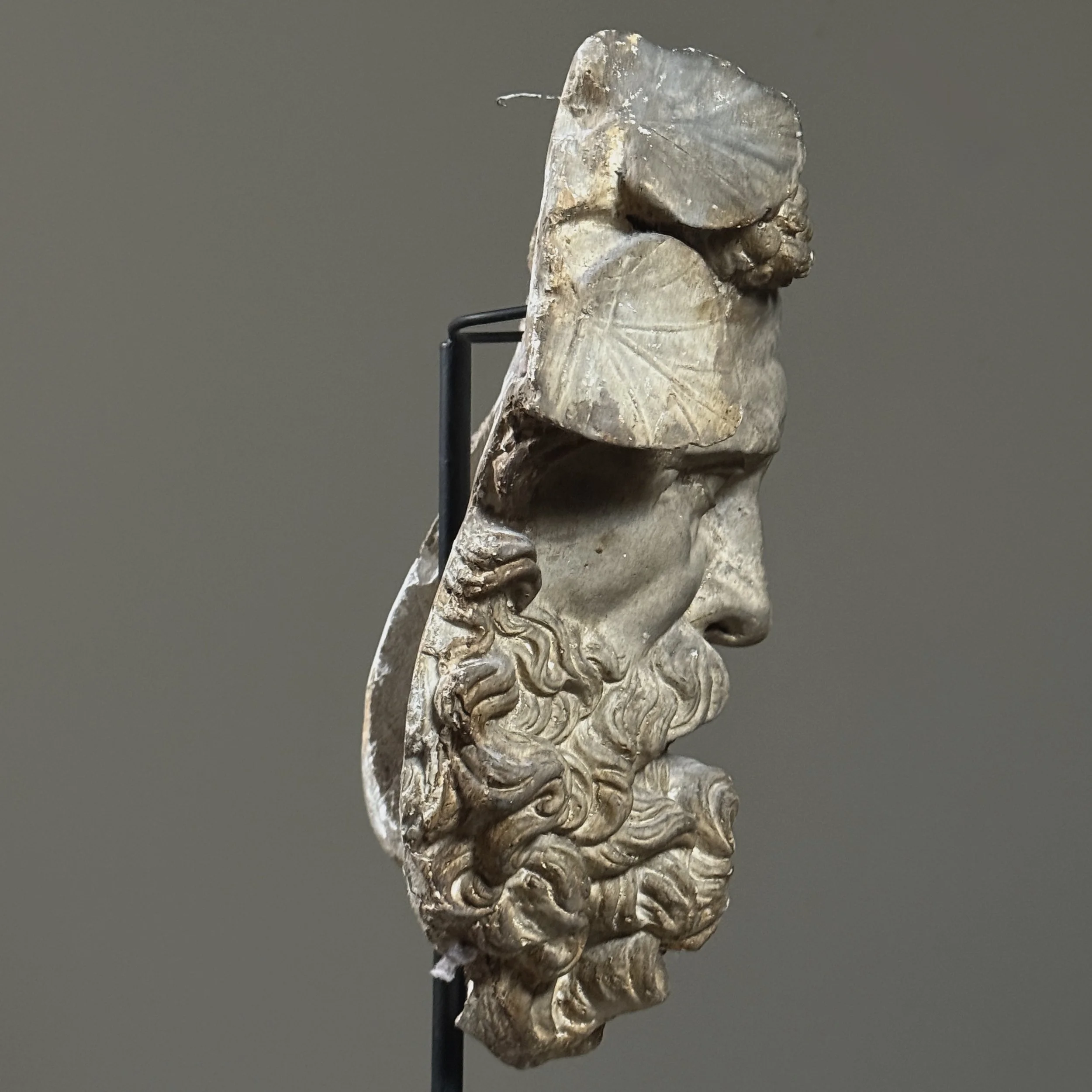 Second side view of the plaster Silenus portrait highlighting the patina and texture.