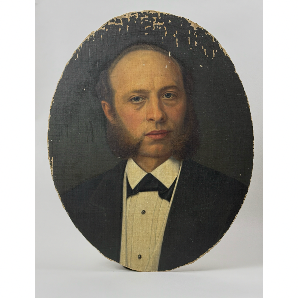 Front view of antique Victorian oval portrait of man with bow tie
