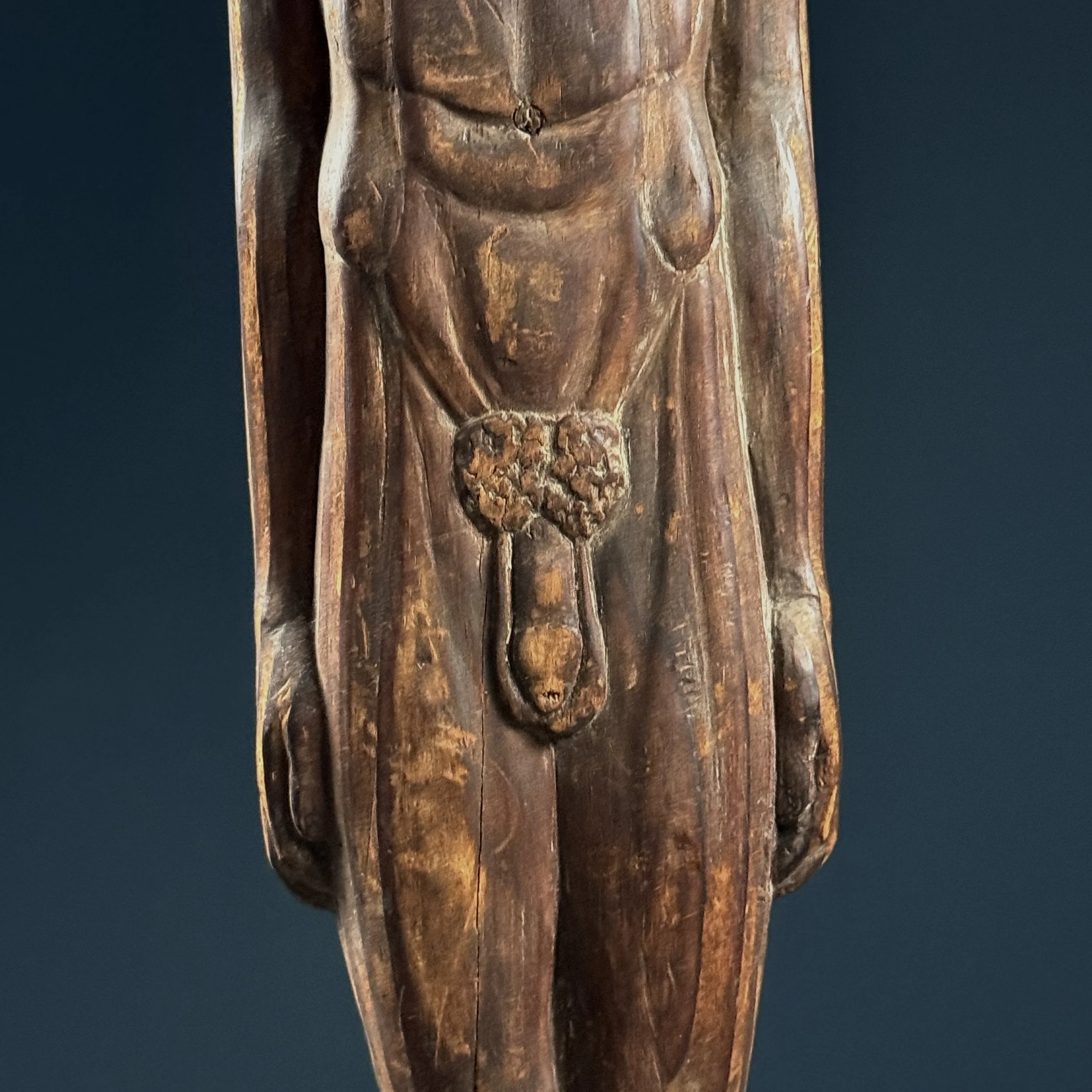 Close-up of weathered patina and tool marks.