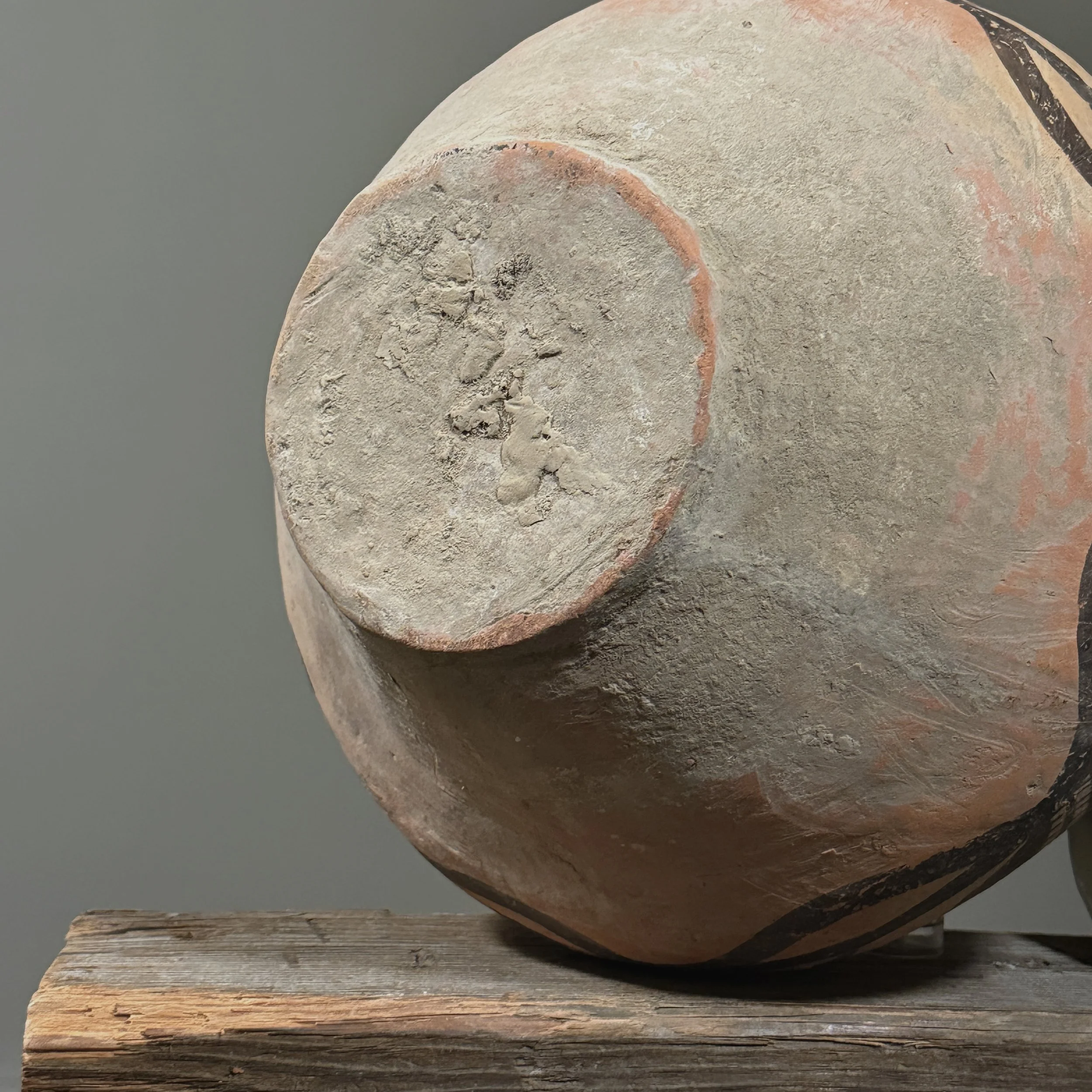 The base of the jar showing natural dirt accumulation