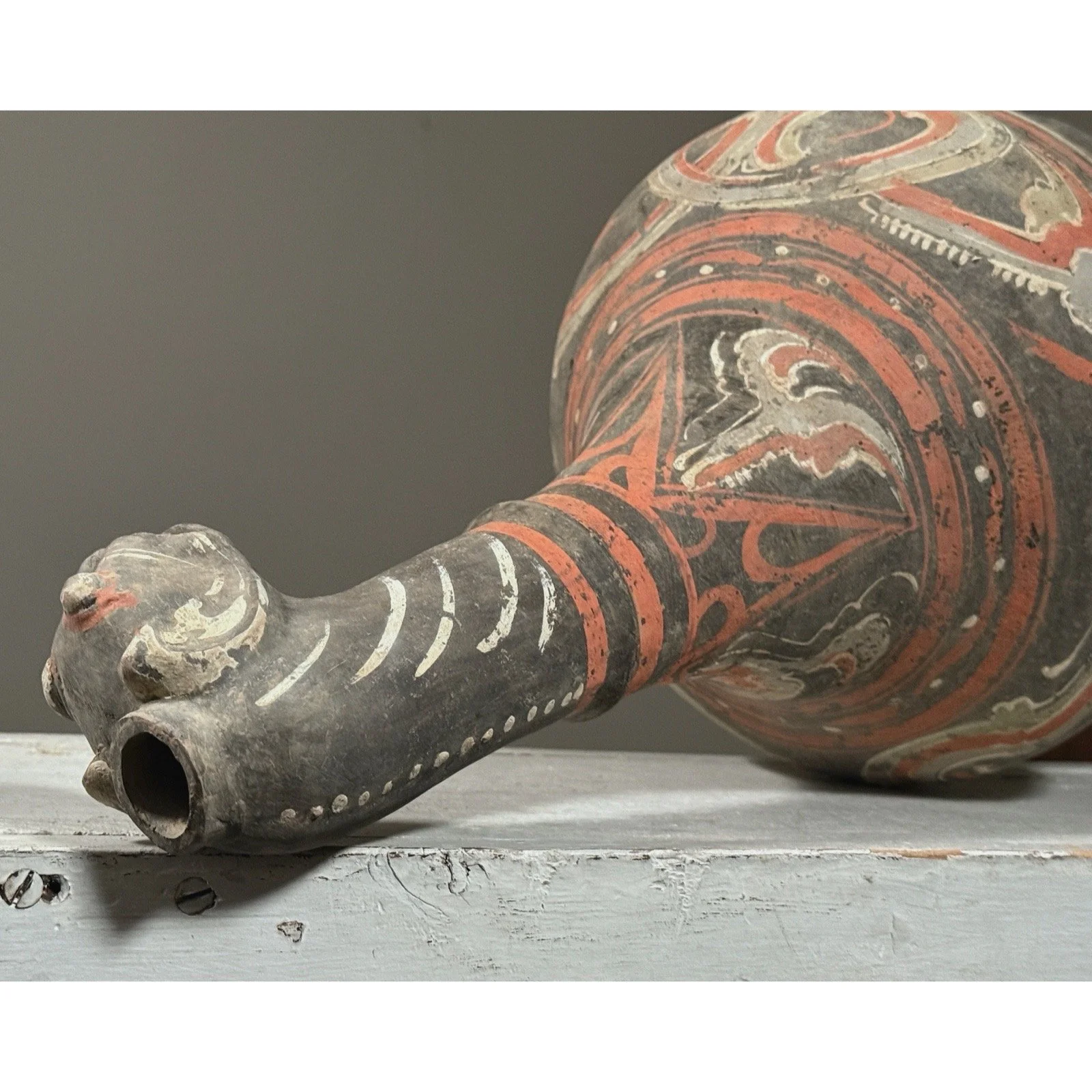 Close up of animal shaped spout on Chinese ceramic vessel