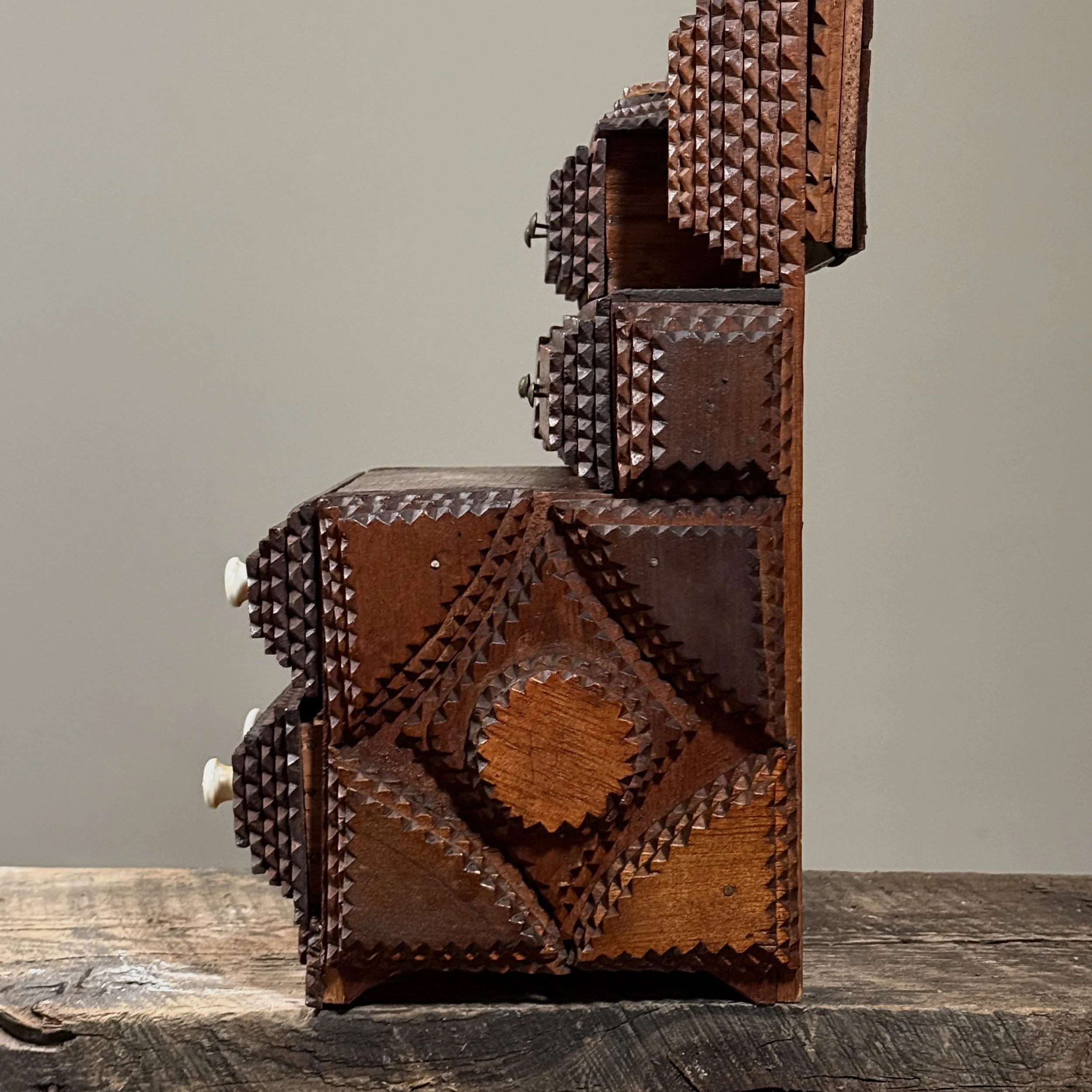 Side view showing the piece's depth and construction.