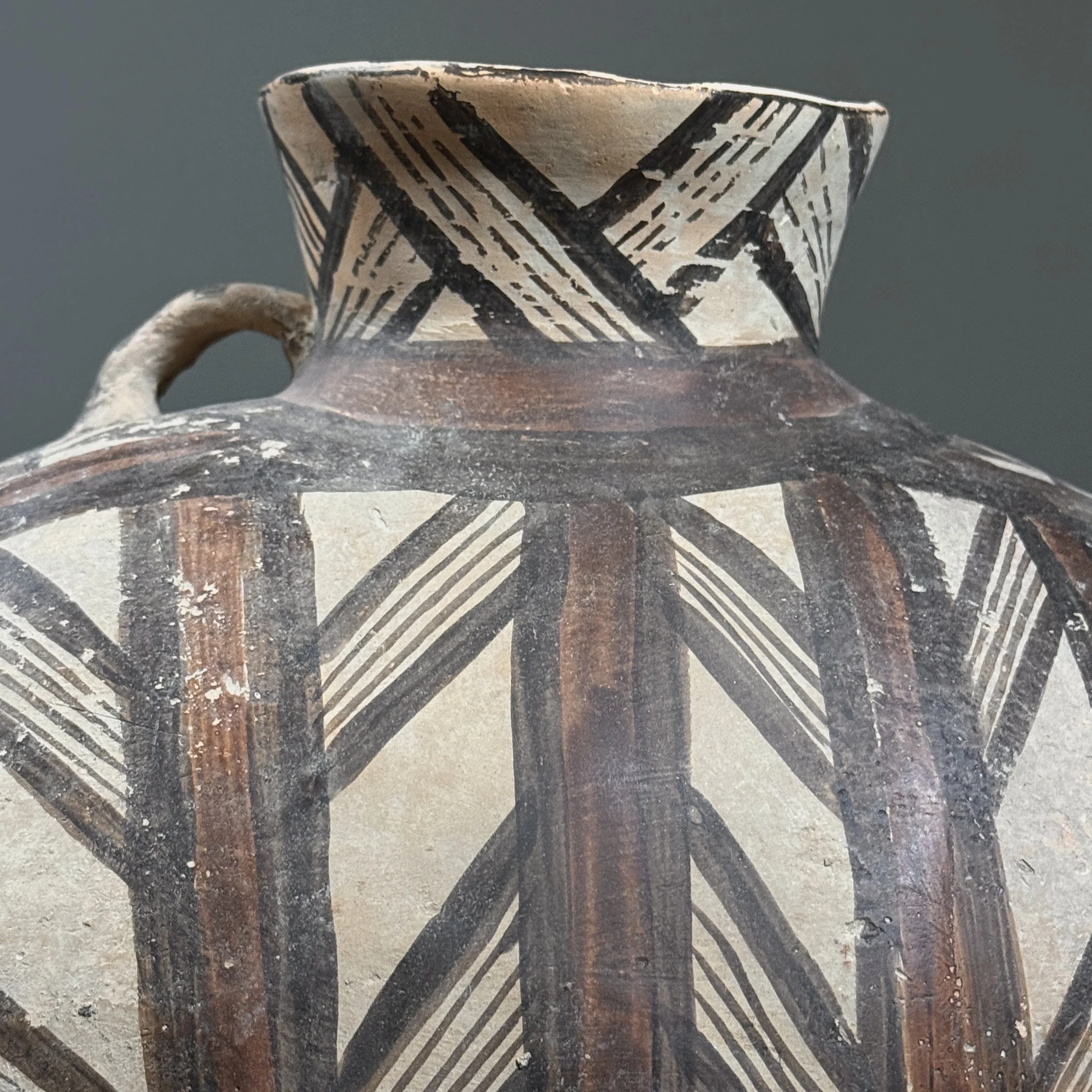 Close-up of geometric black and red motifs