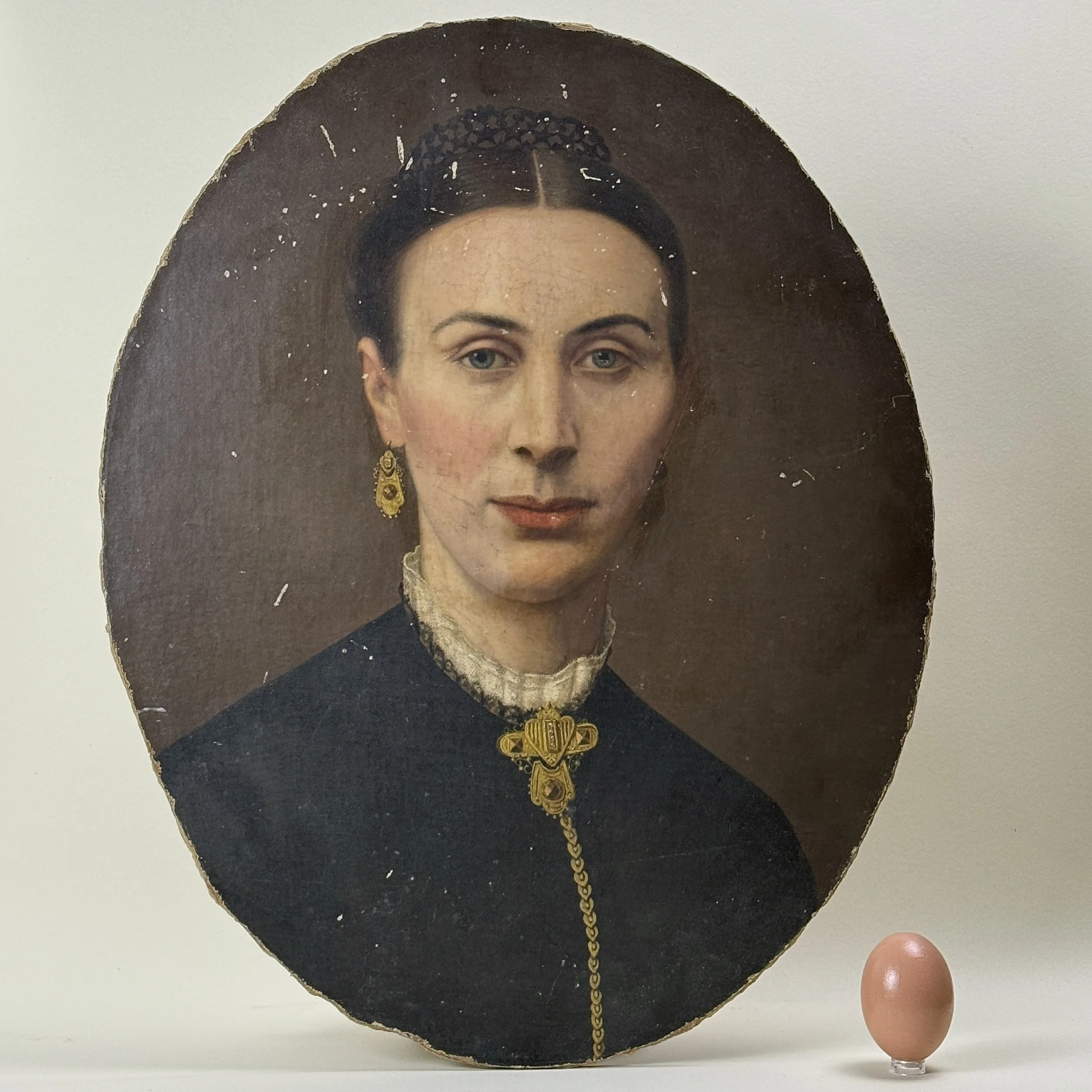 Antique Victorian portrait of a woman in black. Oil on board. Unframed. With an egg for size reference.