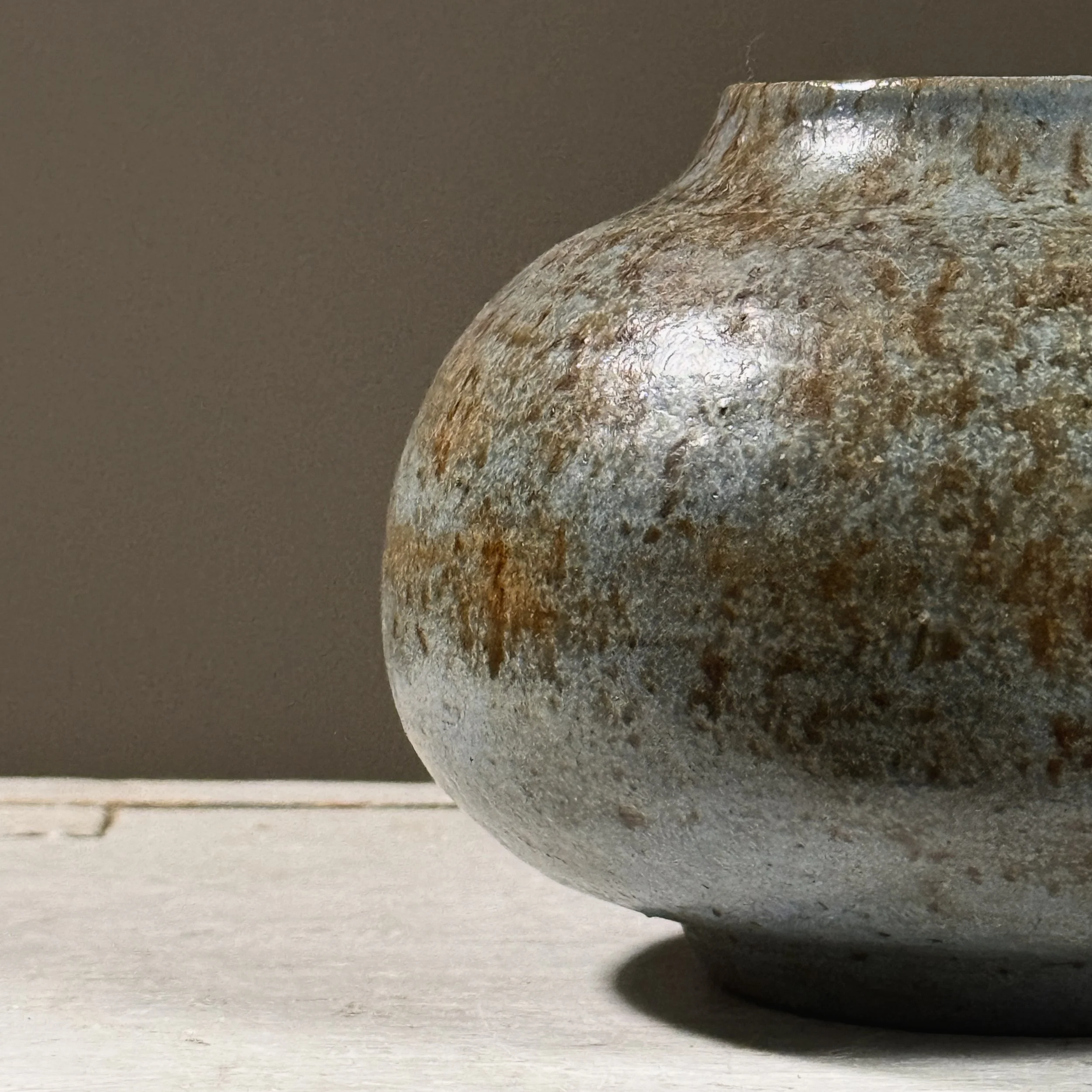 Detail of the splatter glaze technique and color interaction.