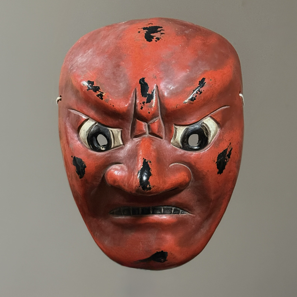 Antique Japanese Noh red devil mask. Carved wood with lacquered finish. 11 inches high. Signed on back.