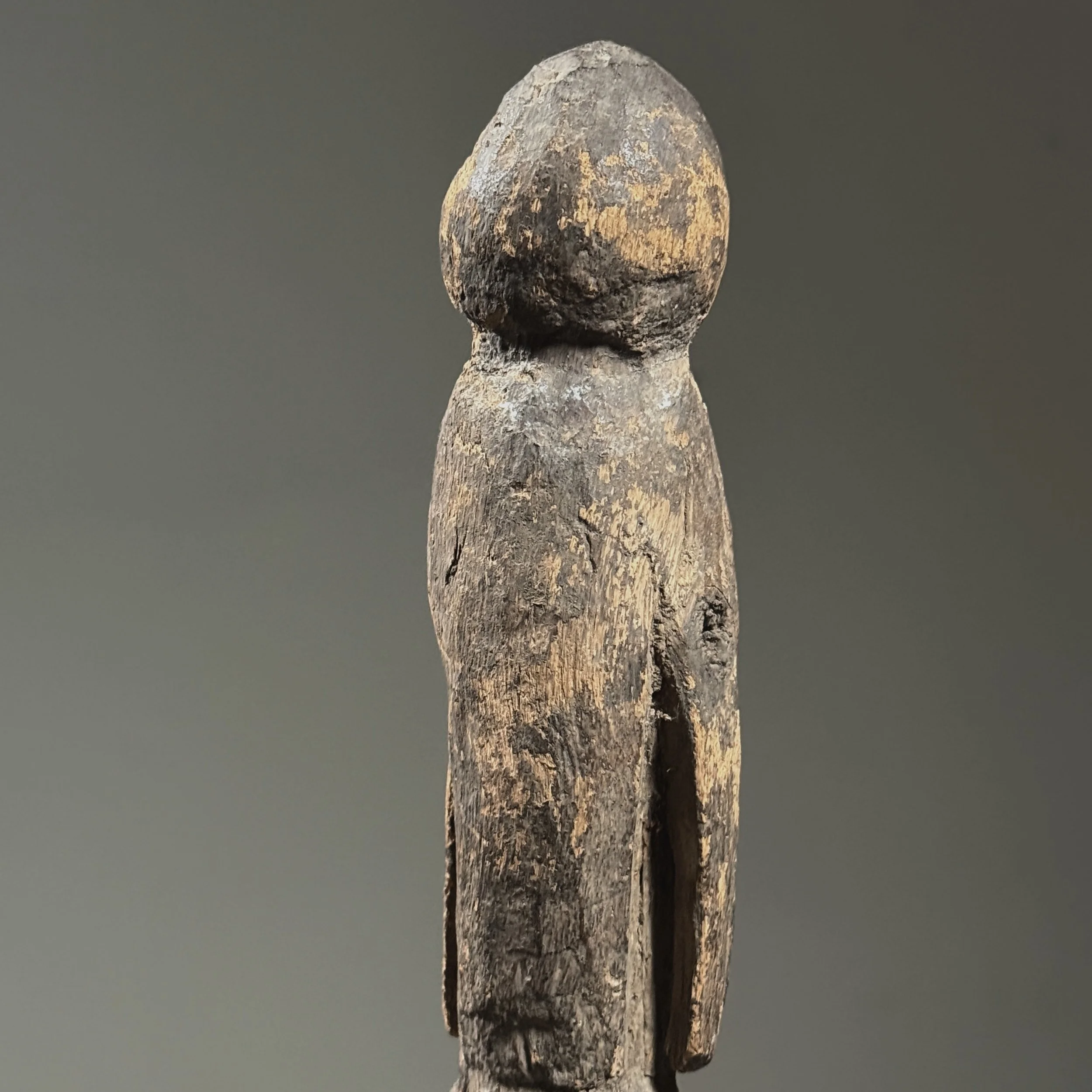 Macro detail of the wood grain and patina developed through decades of handling and exposure