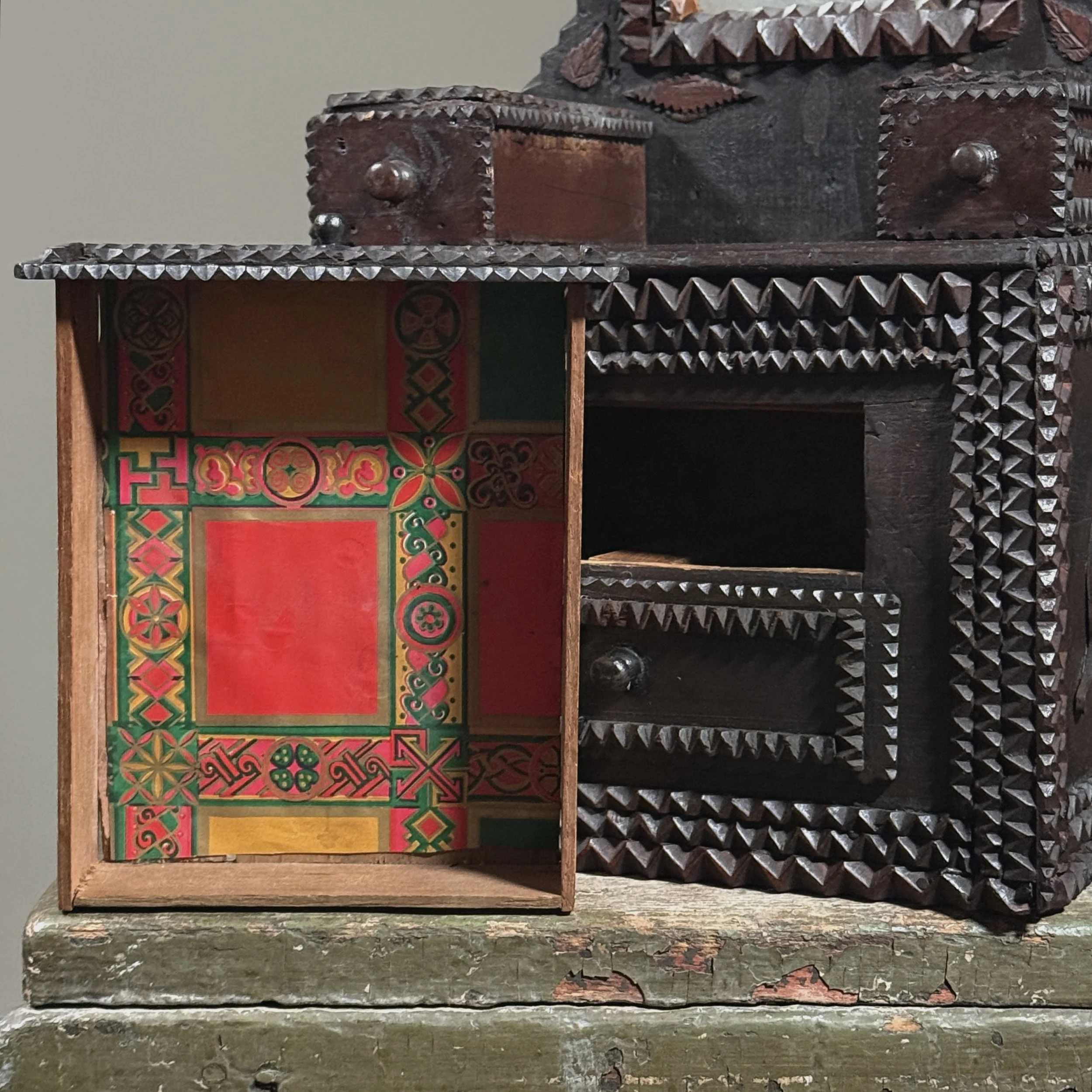 Side view showing the applied chip-carved leaf motif.