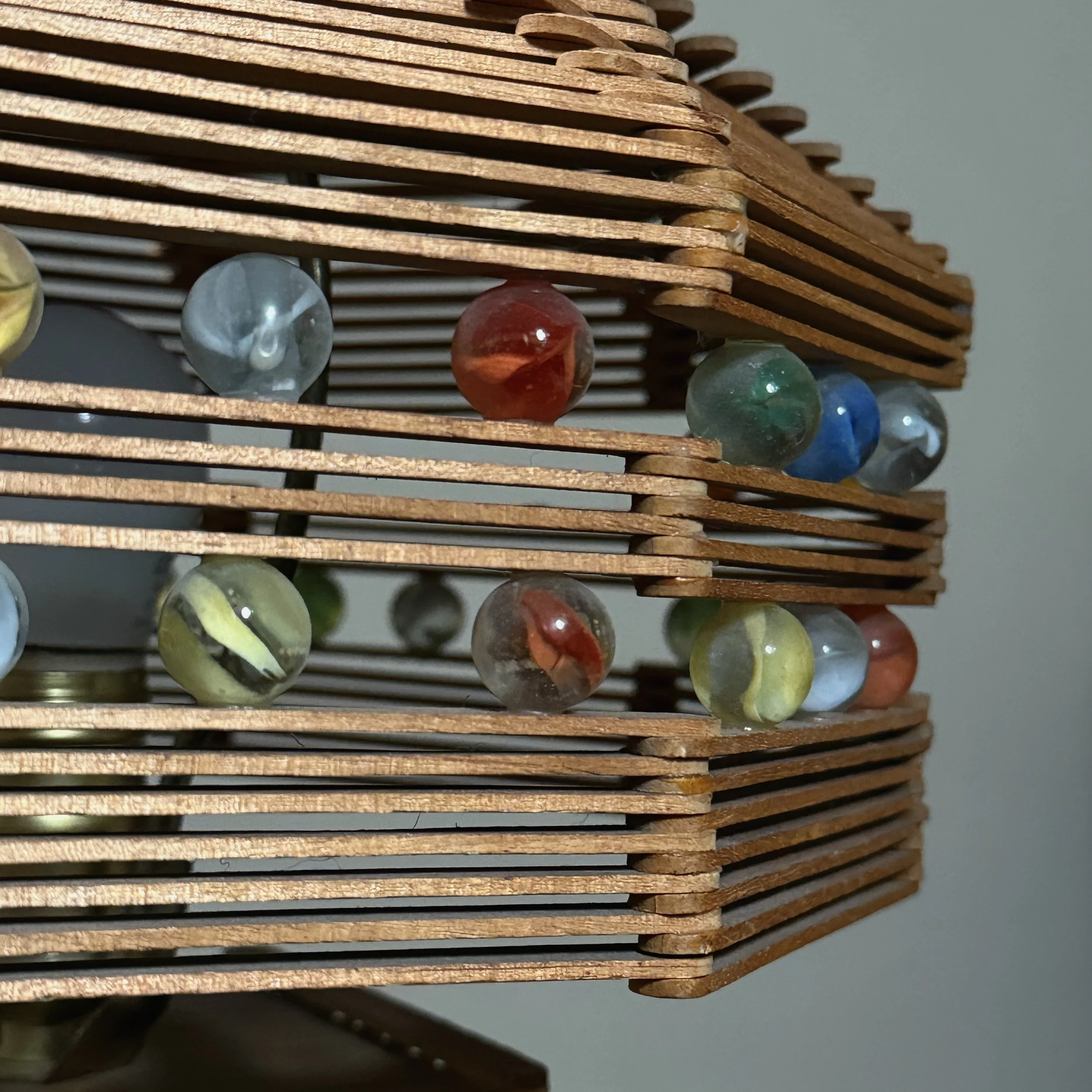 Detail of the glass marbles integrated into the wooden lattice structure