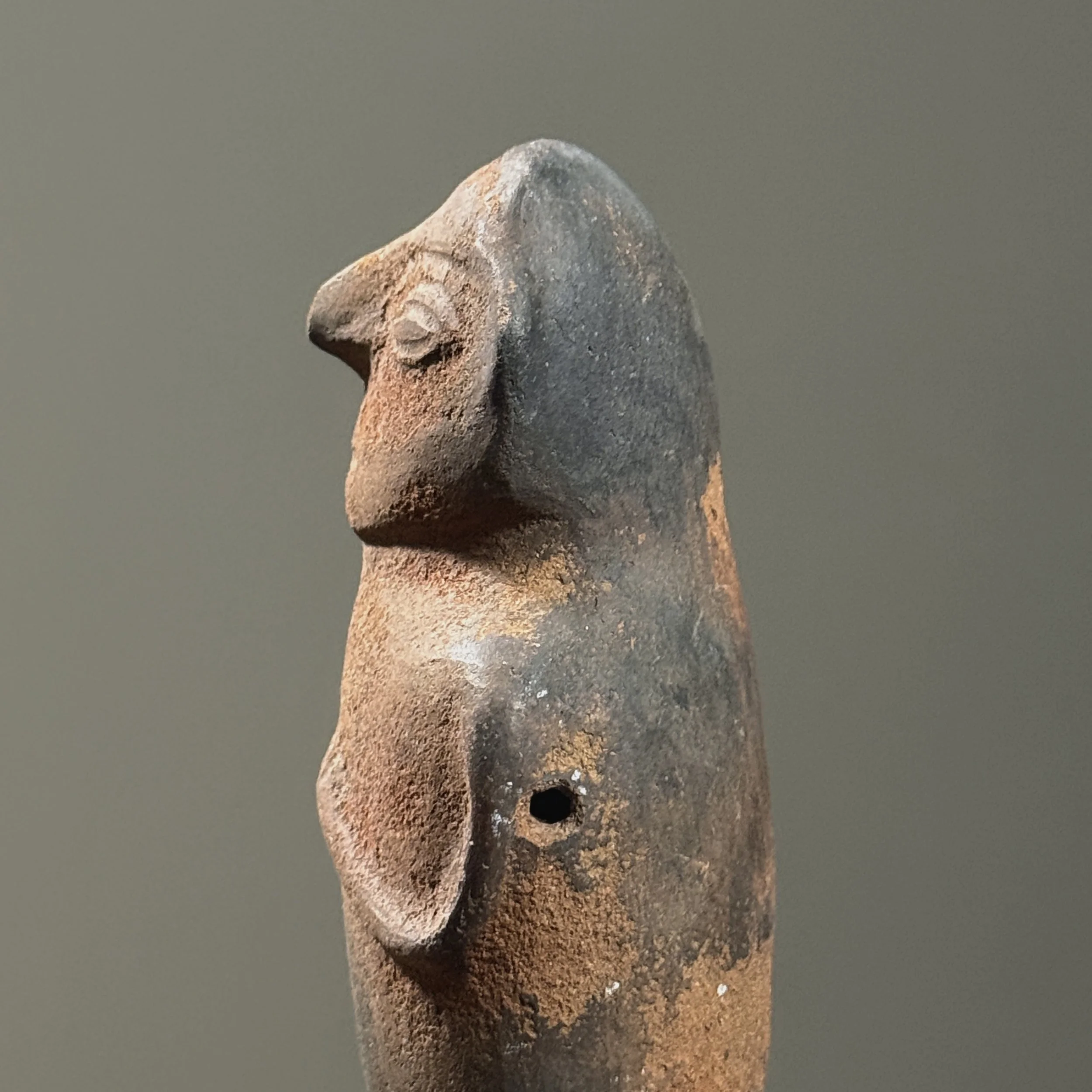 Side view of rattle. Figurative form. Wood fired clay surface.