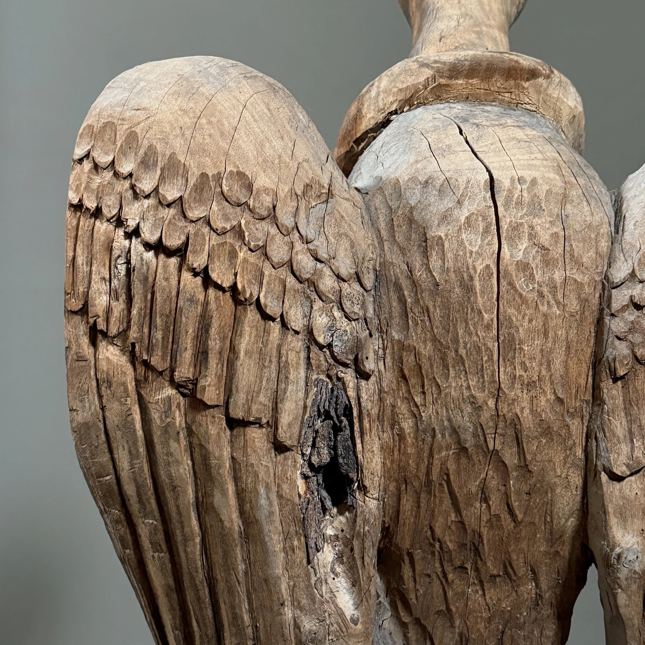 Monumental folk art bird carving wing detail