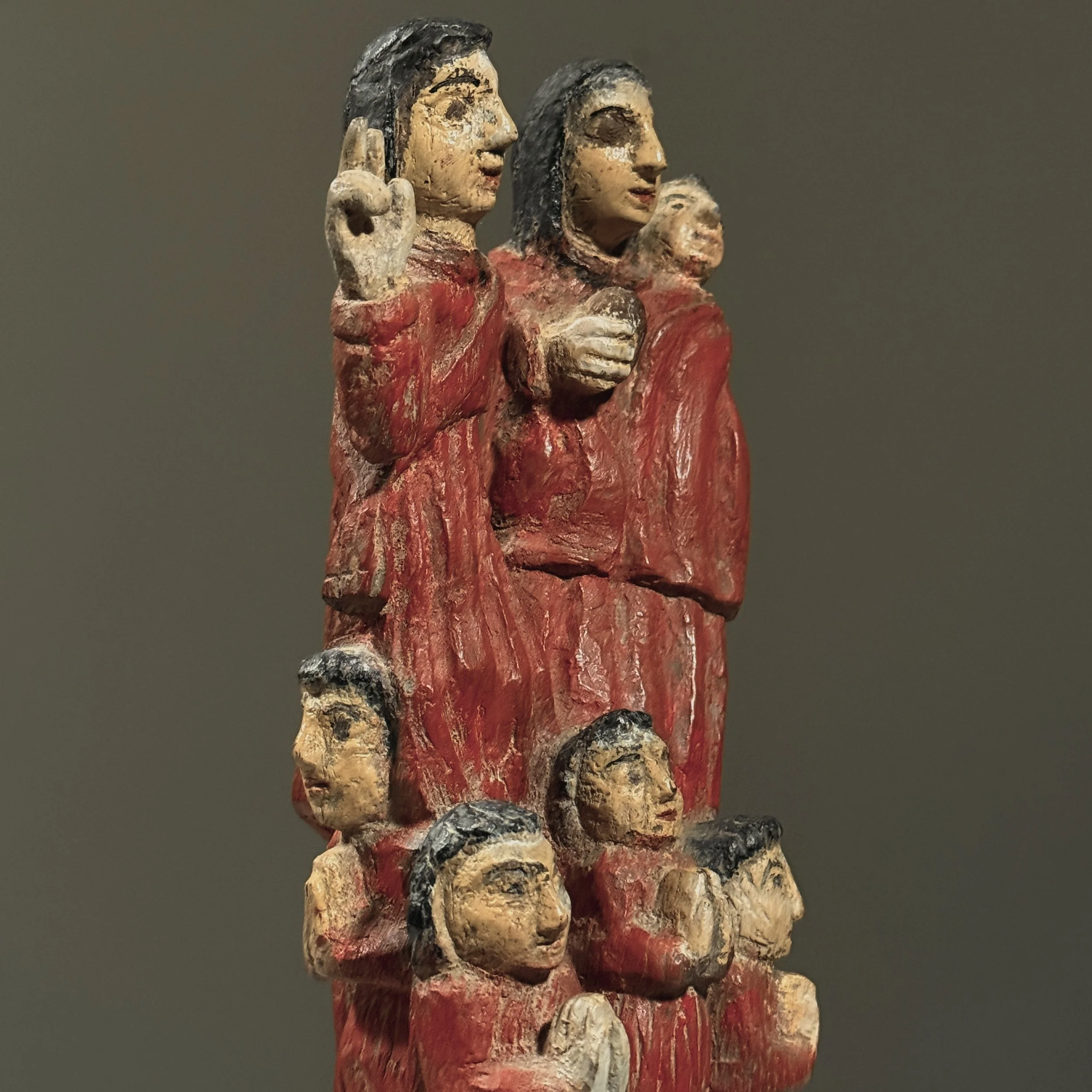 Detail of carved figures on antique Santos sculpture