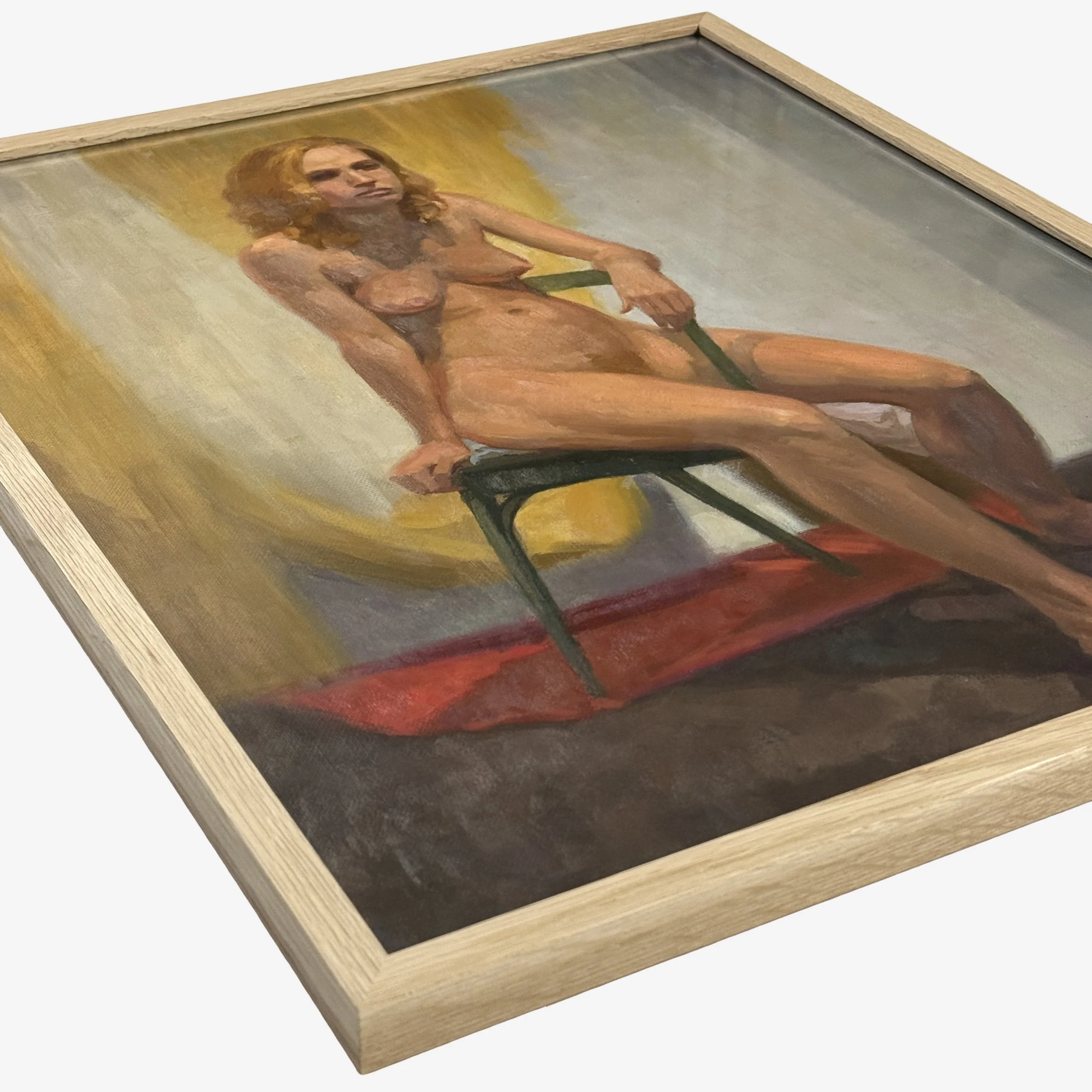 Seated nude figure study with a yellow and grey fabric backdrop and a red cloth at her feet.