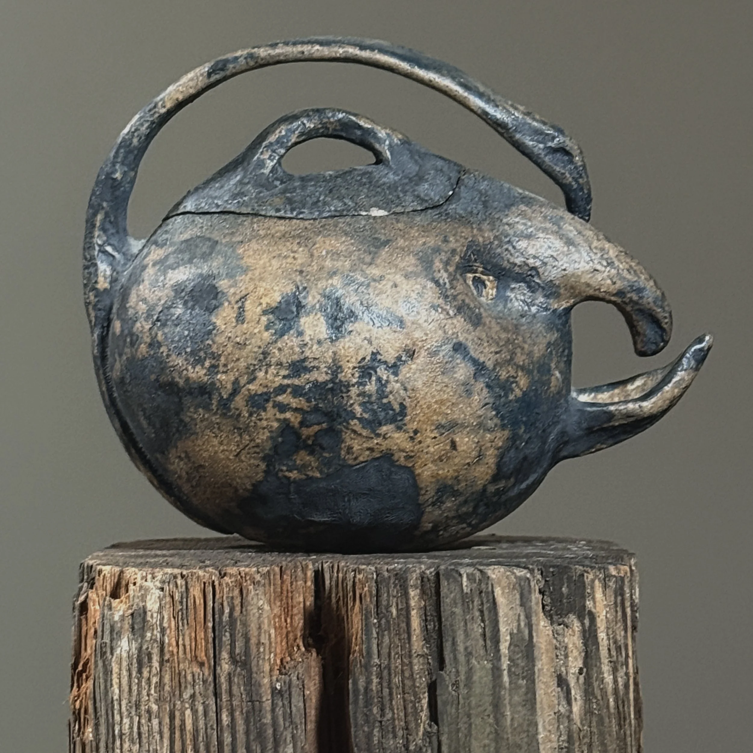 Wood-fired handmade teapot with sculptural facial features