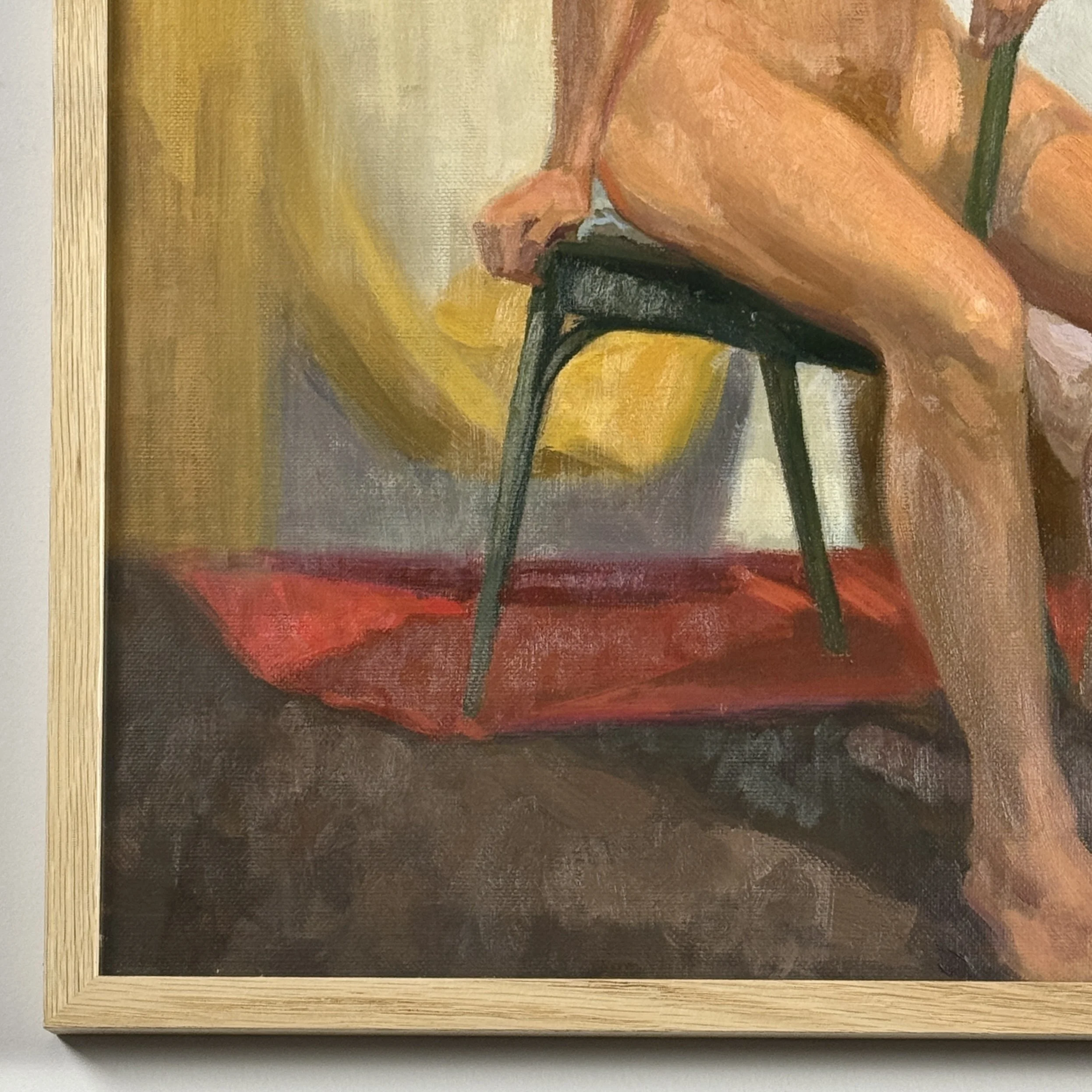 Framed academic art featuring a nude woman model in an interior setting with textured fabrics.