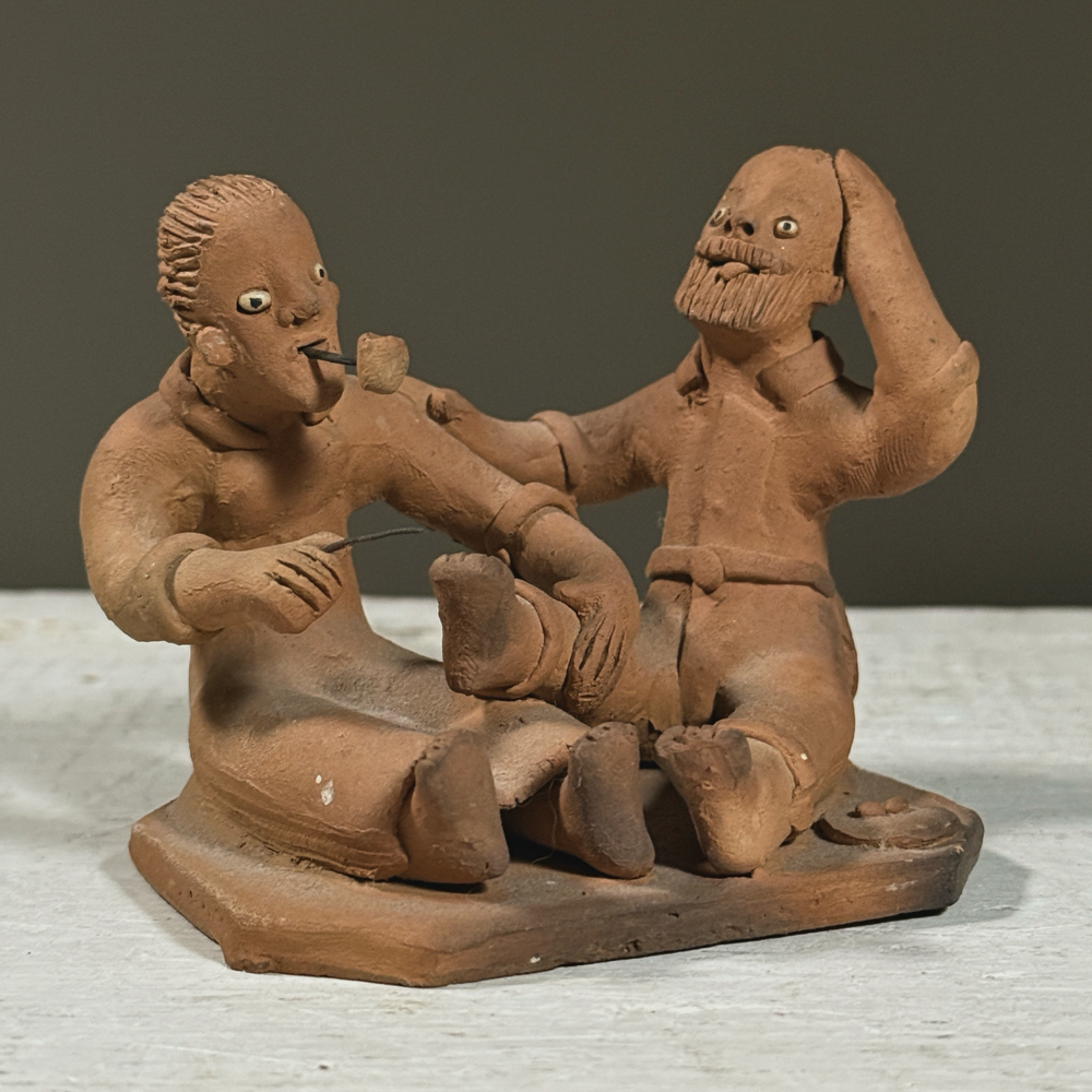 Vintage Brazilian folk art clay sculpture of two figures, signed Berenice