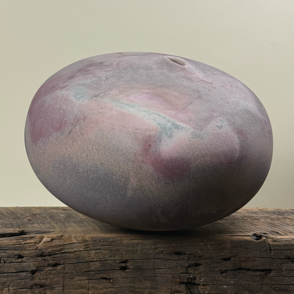Jeffrey Zigulis large anagama fired seed pot vessel. Muted mauve and magenta hues. 12.5 inches diameter.