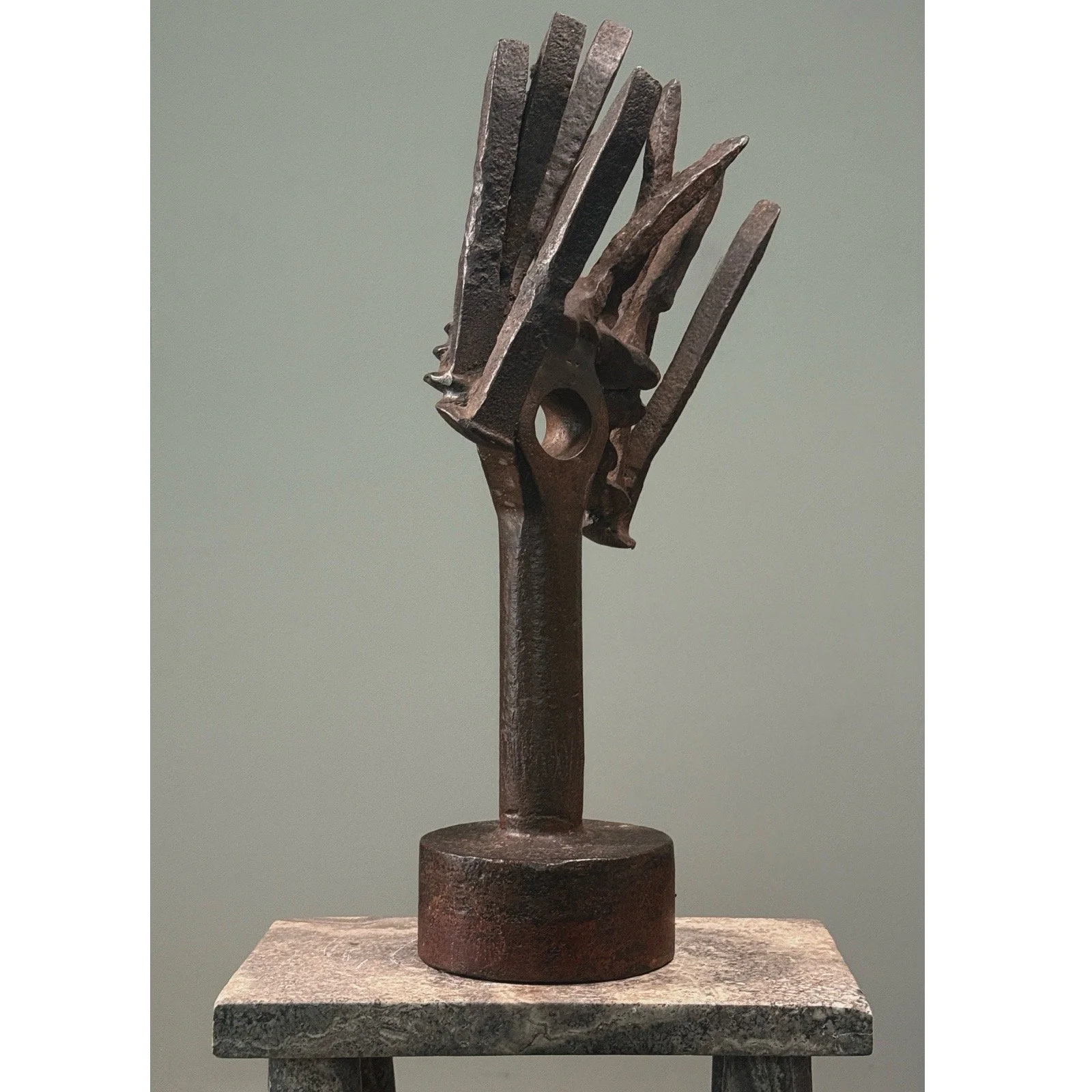 Side view of Vintage Brutalist abstract forged iron sculpture on white background. 17.5 inches tall.