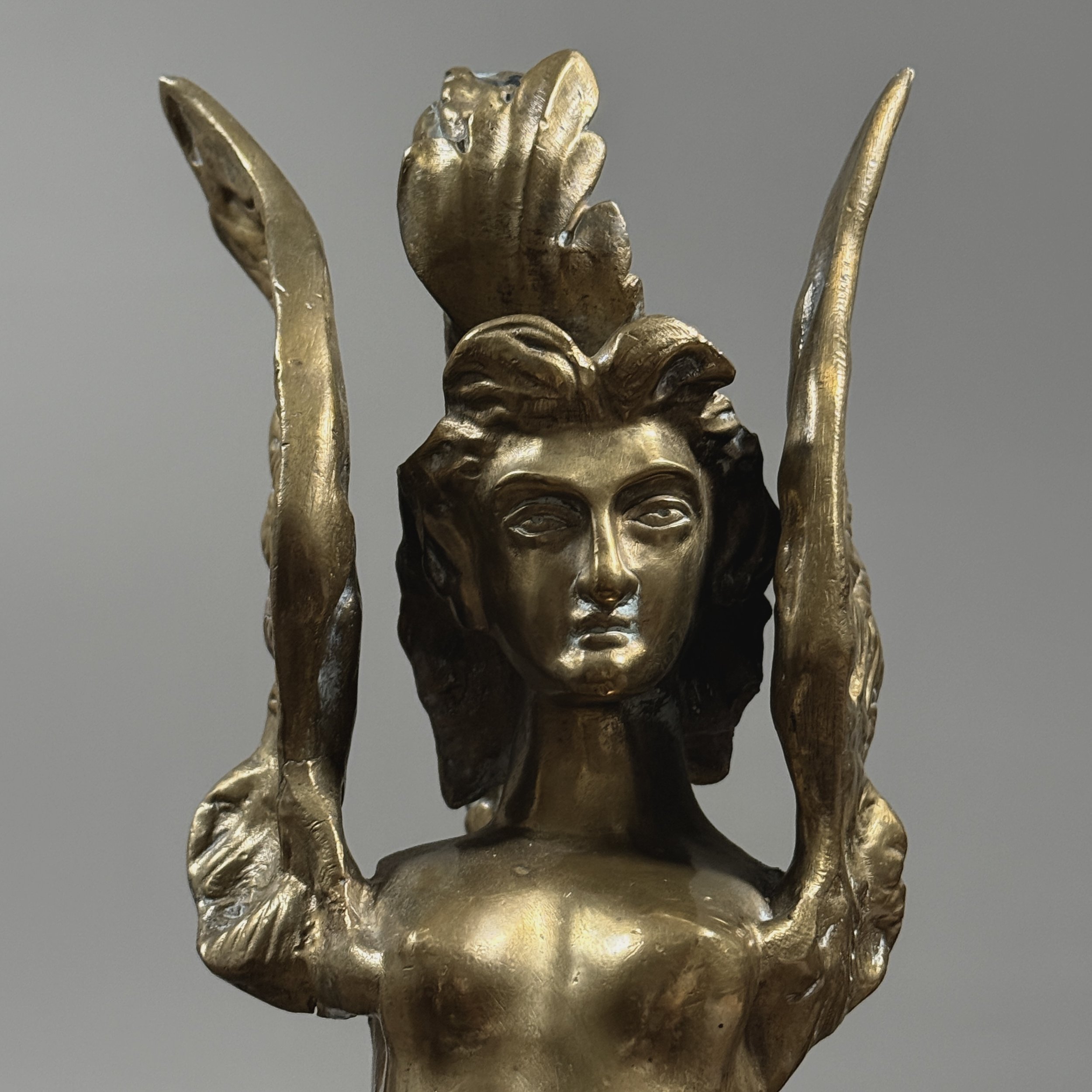 Detail view, pair of brass Melusine sculptures, Neoclassical style