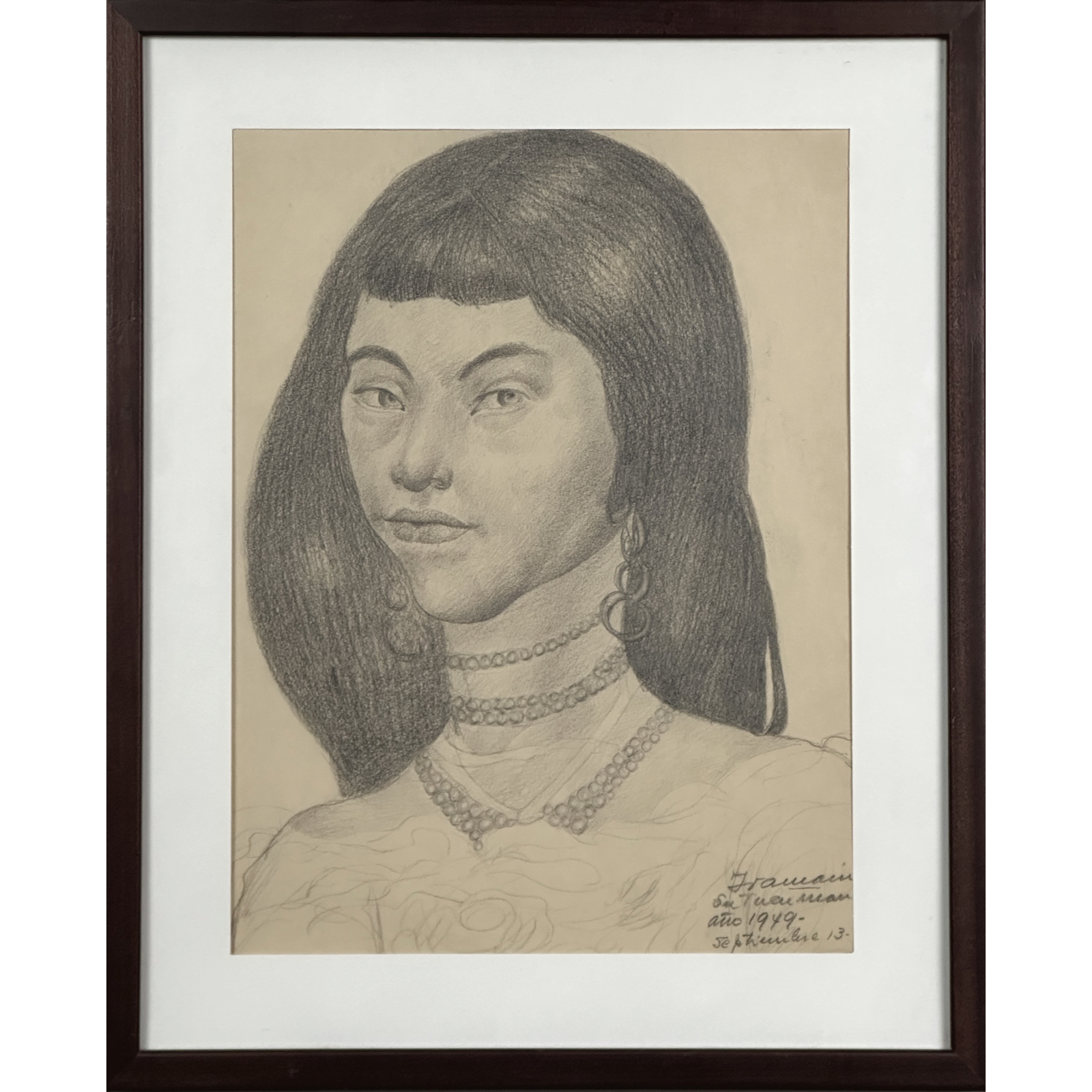 Full frontal view of a framed graphite portrait of a young woman by Juan Carlos Iramain.