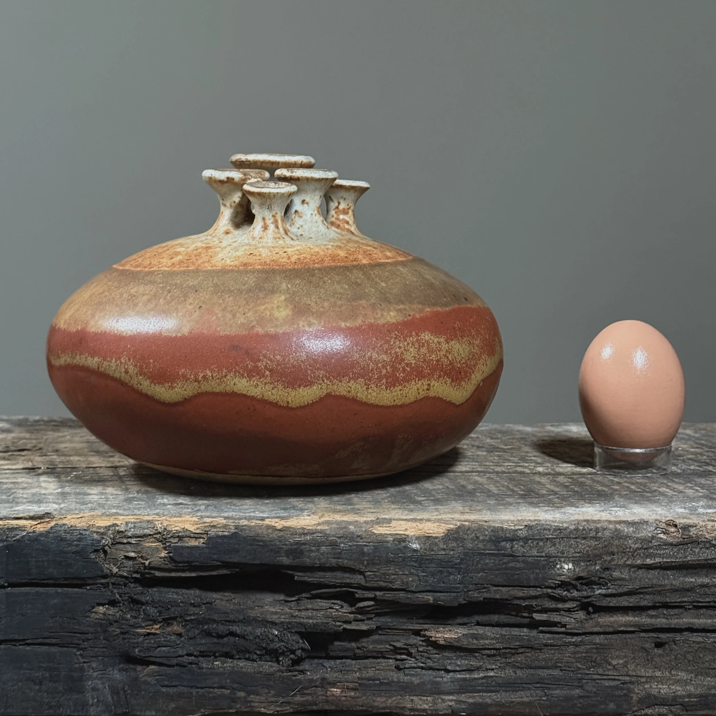 Vintage wood-fired ceramic sculpture by Isabel Parks with egg for size reference.