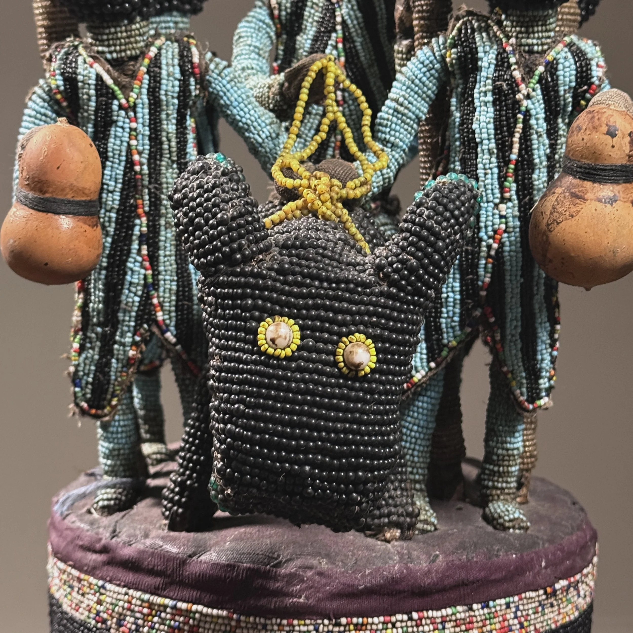 Close-up detail of the central equestrian motif on a Yoruba ceremonial headdress