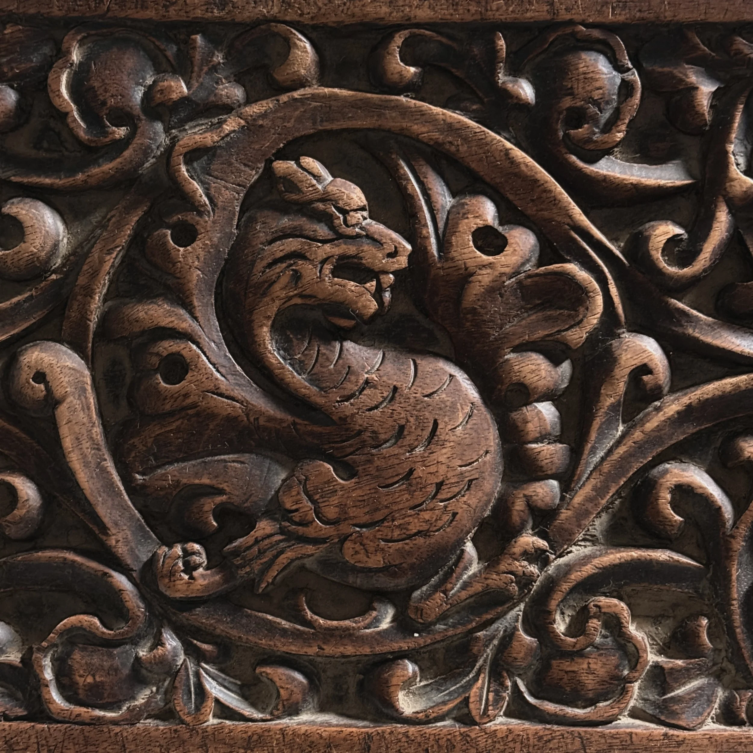Antique hand-carved Gothic English step stool with scrolled lion and Green Man carvings